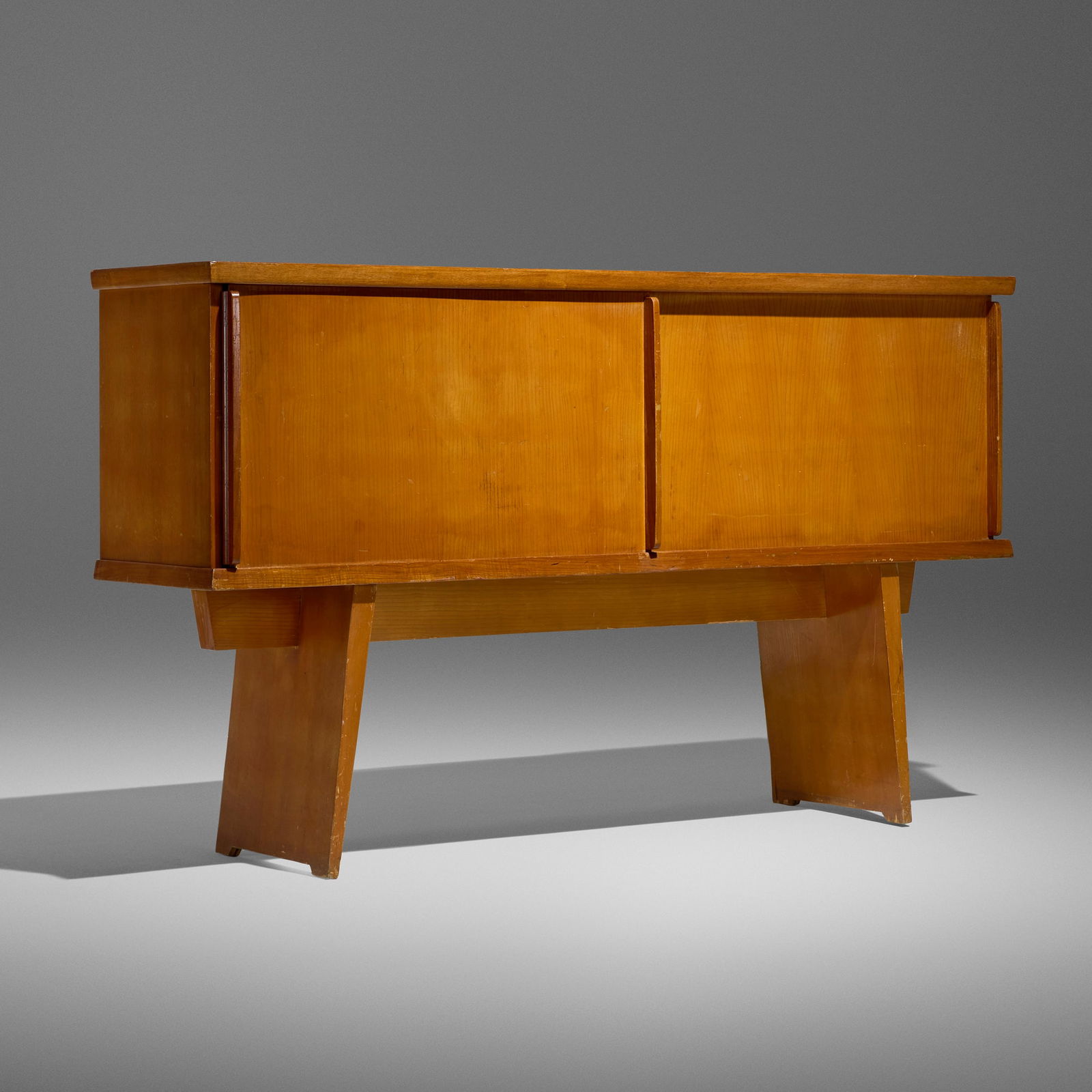 Charlotte Perriand and Pierre Jeanneret, Rare sideboard: Charlotte Perriand and Pierre Jeanneret Rare sideboard France, 1939-45 oak 38.25 h x 65 w x 16.5 d in (97 x 165 x 42 cm) Sideboard features two sliding doors concealing three shelves. Provenance: