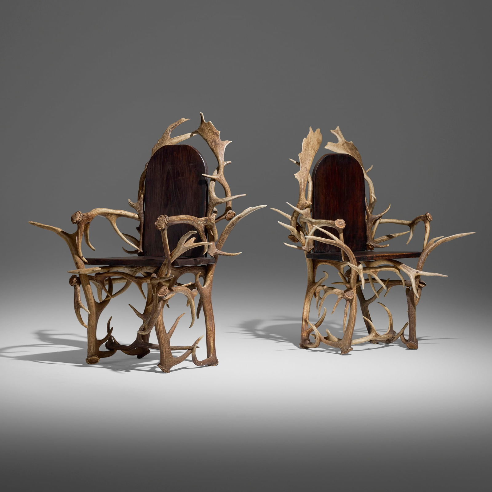 20th Century, Antler chairs, pair: 20th Century Antler chairs, pair antlers, stained oak 44.75 h x 37.75 w x 27.5 d in (114 x 96 x 70 cm) Chairs are comprised of elk and caribou antlers. Provenance: JF Chen, Los Angeles This