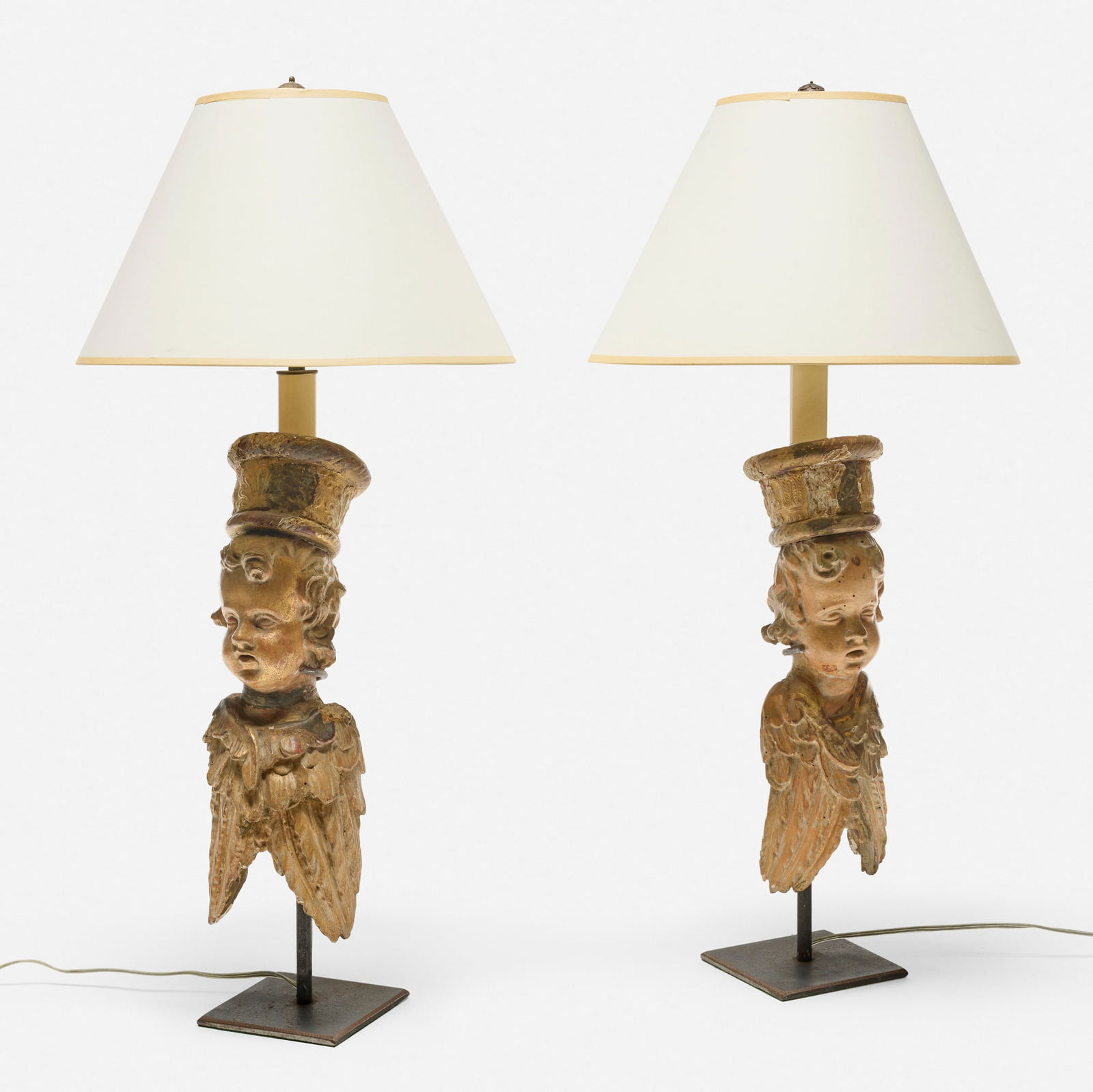 Italian, Cherub table lamps, pair: Italian Cherub table lamps, pair polychrome and gilt wood, steel, paper shade 30 h x 14 dia in (76 x 36 cm) Lamps feature repurposed antique 18th-19th century architectural elements. Provenance: