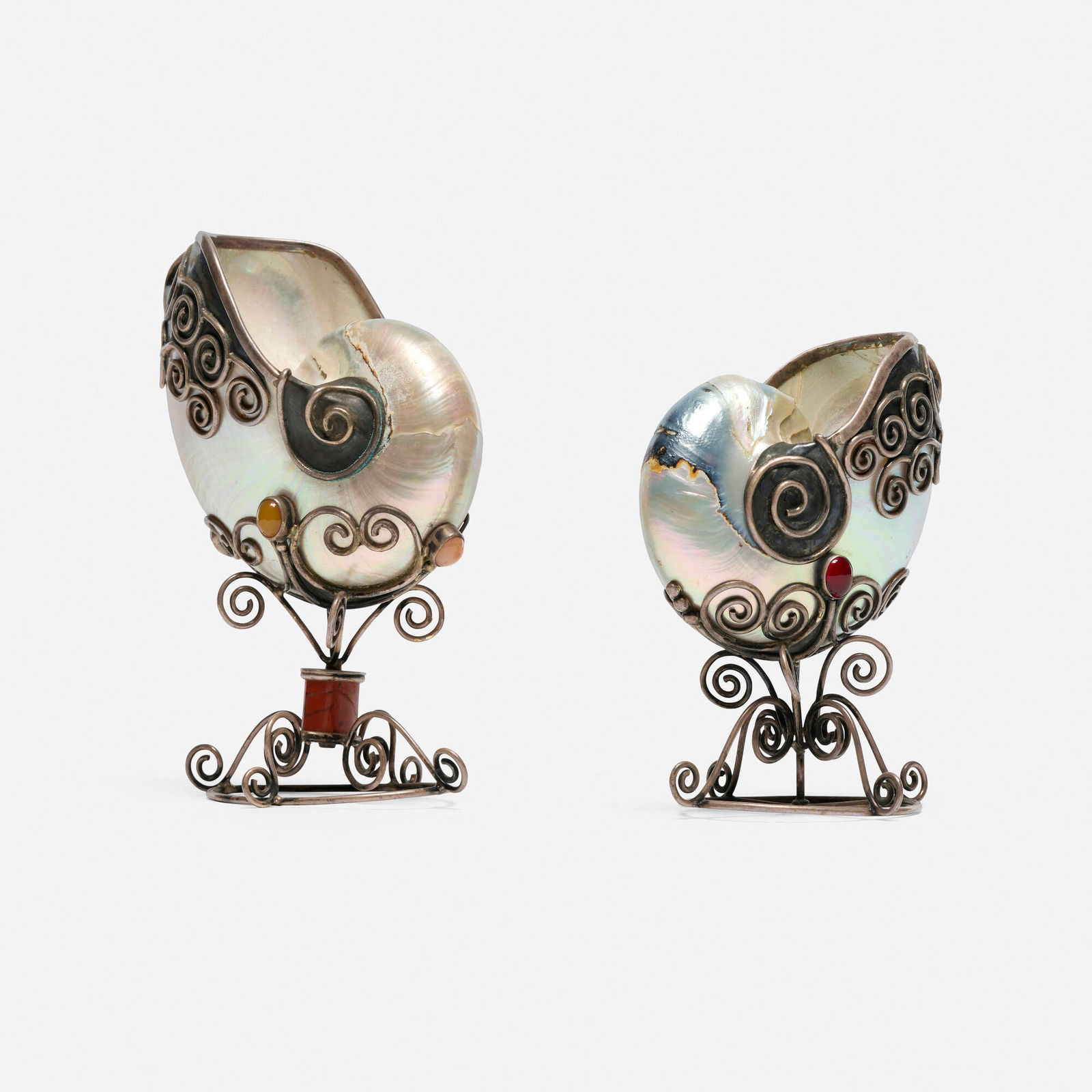20th Century, Nautilus shell compotes, pair: 20th Century Nautilus shell compotes, pair silver, nautilus shell, cabochon gemstones 6.5 h x 5 w x 3 d in (17 x 13 x 8 cm) 5.5 h x 3.25 w x 4 d in (14 x 8 x 10 cm) Provenance: JF Chen, Los