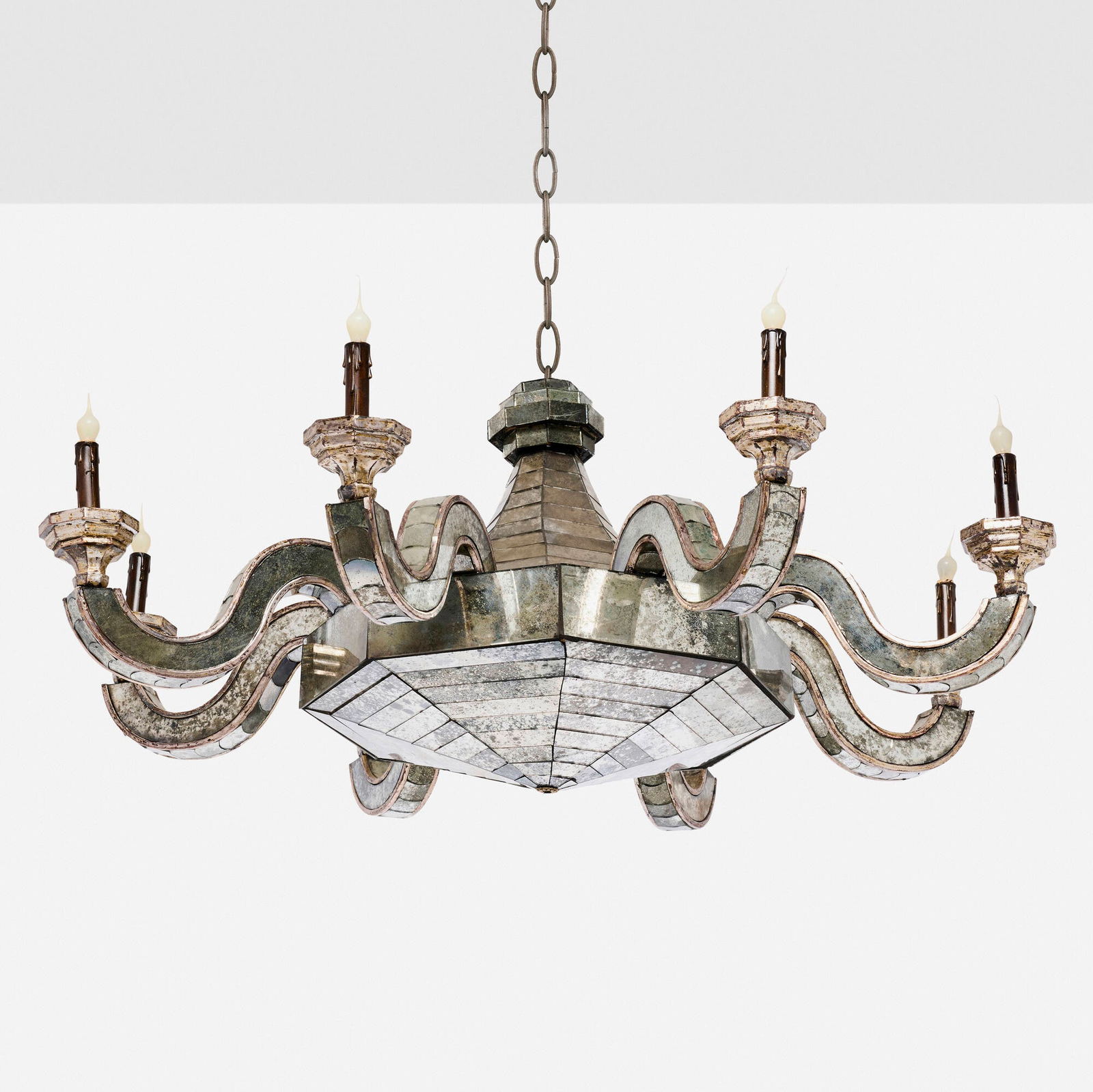 In the manner of Serge Roche, Chandelier: In the manner of Serge Roche Chandelier c. 1950 antiqued mirrored glass, silver gilt wood 22 h x 44 dia in (56 x 112 cm) Provenance: JF Chen, Los Angeles This work will ship from Los Angeles,