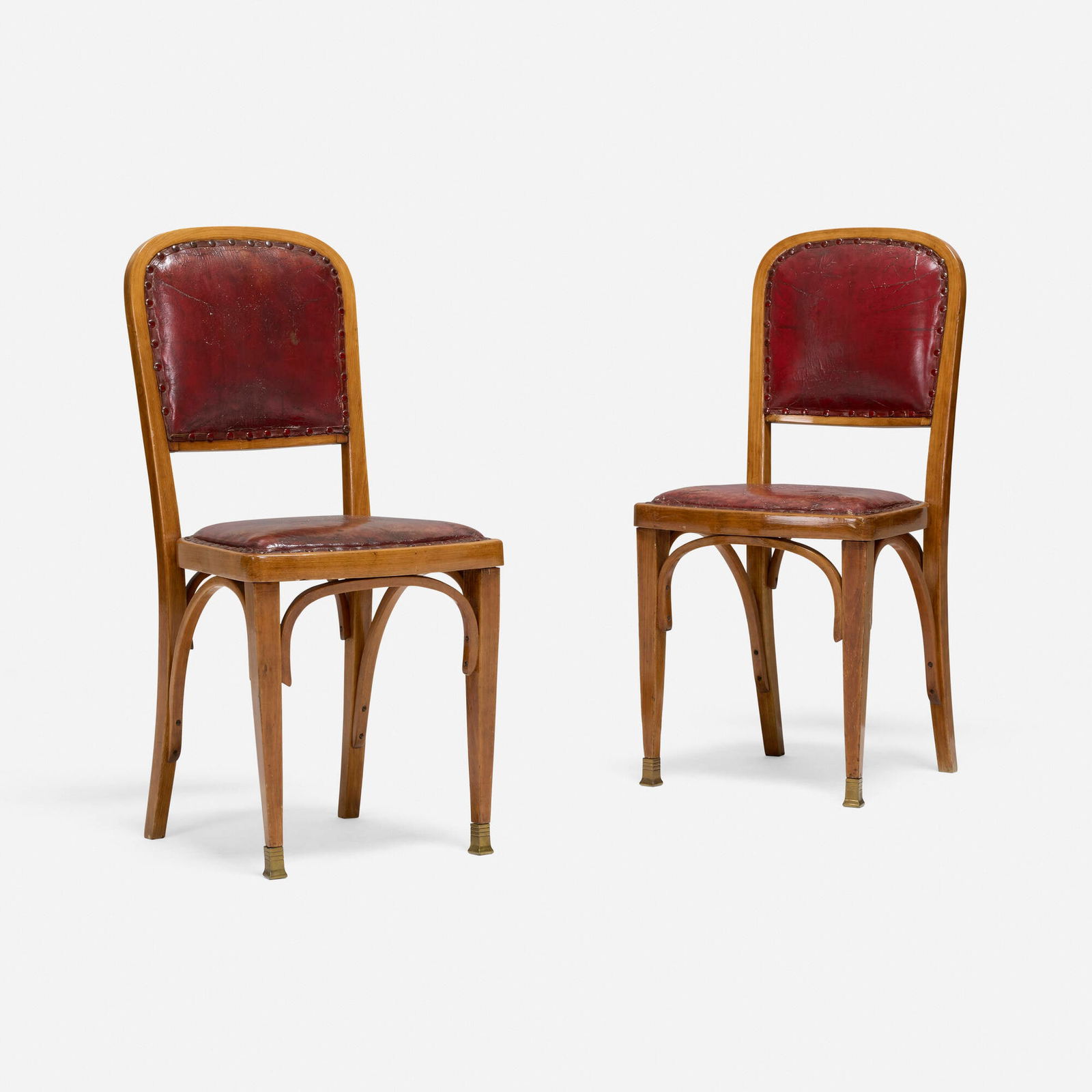 Gustav Siegel, Chairs model 715, pair: Gustav Siegel Chairs model 715, pair J. & J. Kohn Austria, 1899 / c. 1900 leather, mahogany, brass 36.5 h x 16.5 w x 18 d in (93 x 42 x 46 cm) Paper distributor's label to underside of each