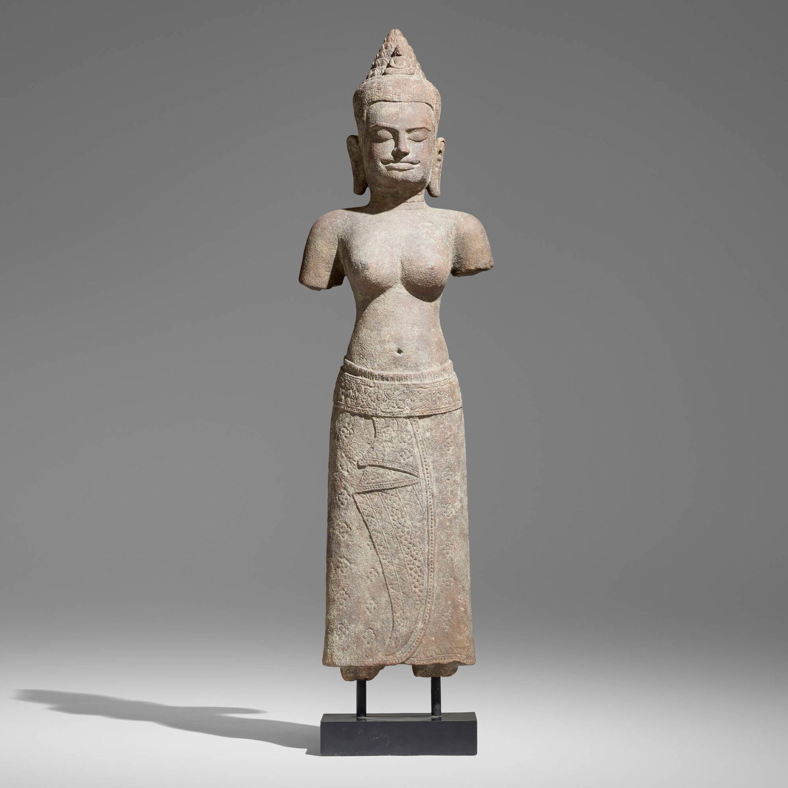 Khmer, Figure of Uma: Khmer Figure of Uma 18th century carved stone 42.5 h x 11.5 w x 6.5 d in (108 x 29 x 17 cm) Provenance: JF Chen, Los Angeles This work will ship from Los Angeles, California.
