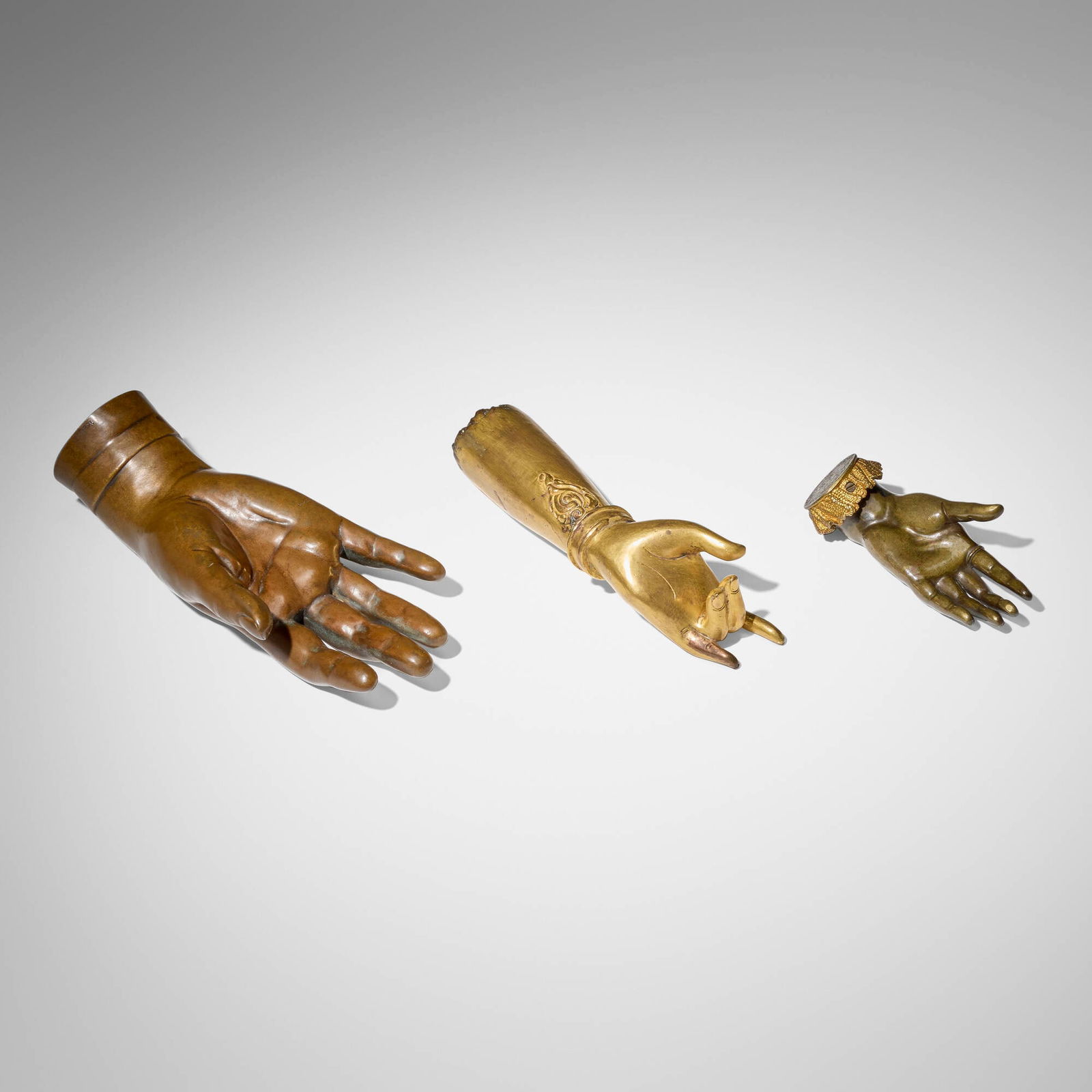 French and Southeast Asian, Collection of three hands: French and Southeast Asian Collection of three hands 19th-20th century bronze, gilt bronze, brass 2.25 h x 9 w x 4.75 d in (6 x 23 x 12 cm) 2.625 h x 7.5 w x 3 d in (7 x 19 x 8 cm) 1.5 h x 5.25 w x