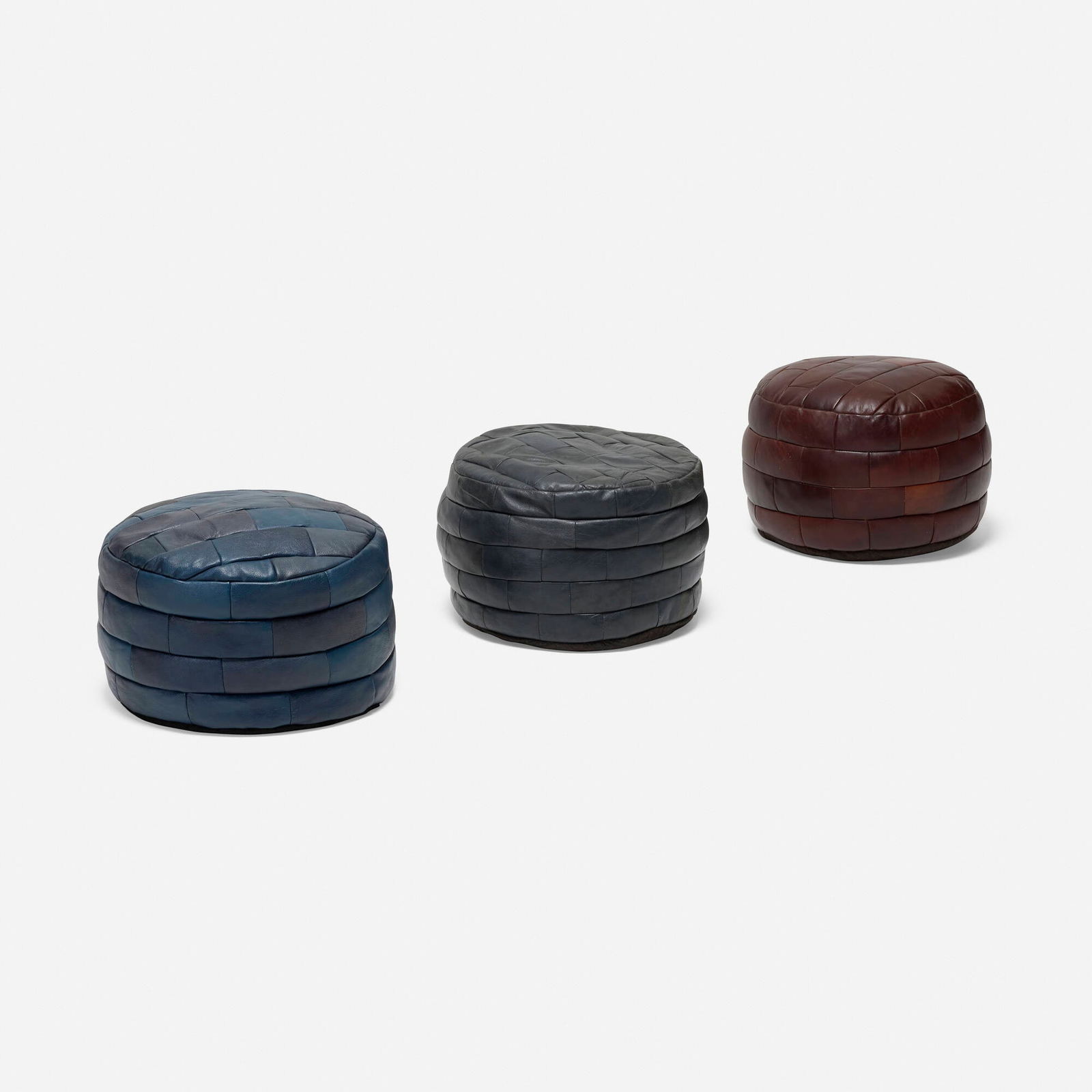 De Sede, DS 80 ottomans, set of three: De Sede DS 80 ottomans, set of three Switzerland, c. 1965 stitched leather 14 h x 20 dia in (36 x 51 cm) This work will ship from Los Angeles, California.