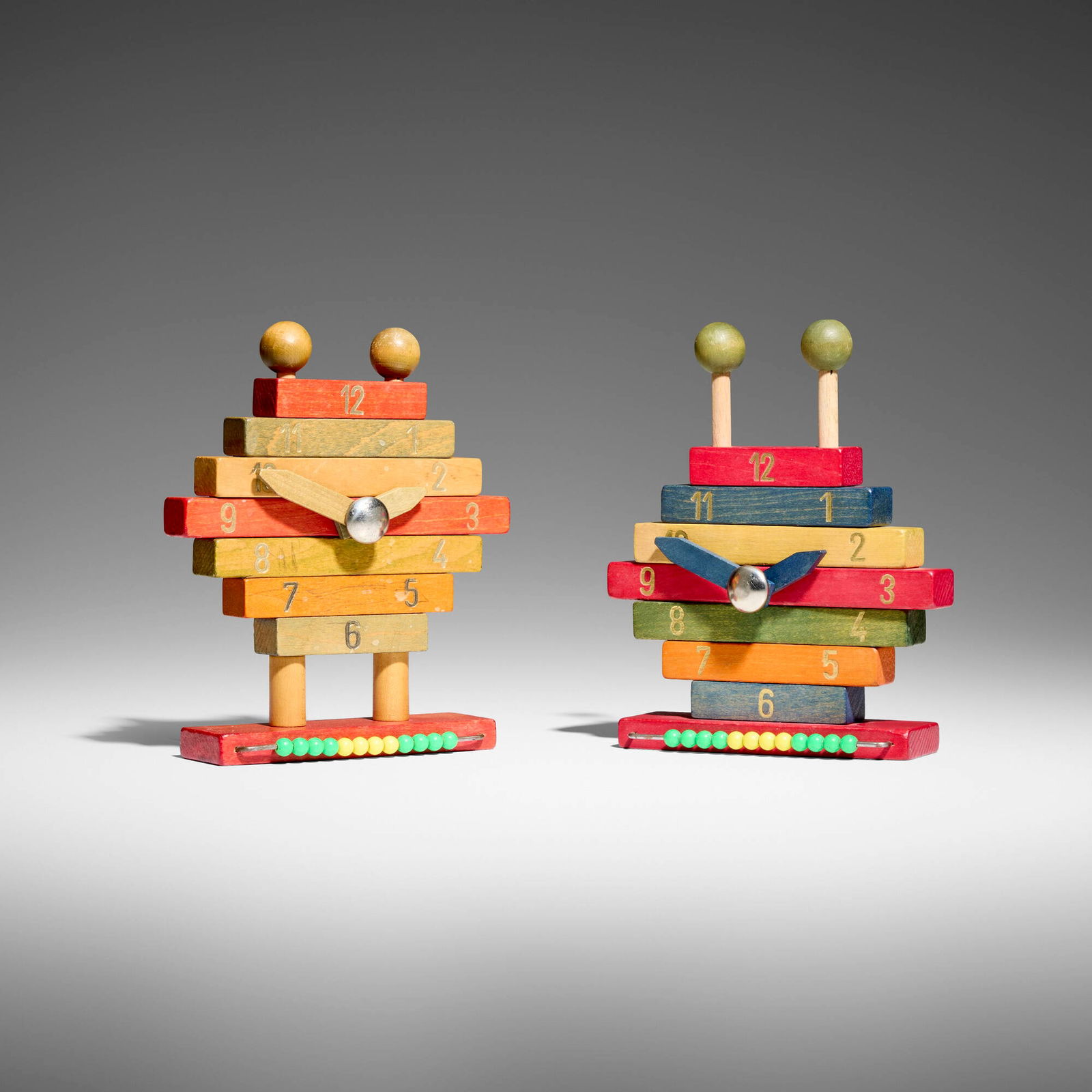 Ettore Sottsass, Rare building block toy clocks, set of two: Ettore Sottsass Rare building block toy clocks, set of two Italy, c. 1965 dyed wood, gold leaf, stainless steel, plastic 6.5 h x 5.5 w x 2 d in (17 x 14 x 5 cm) Literature: "Rare Gems from Ettore