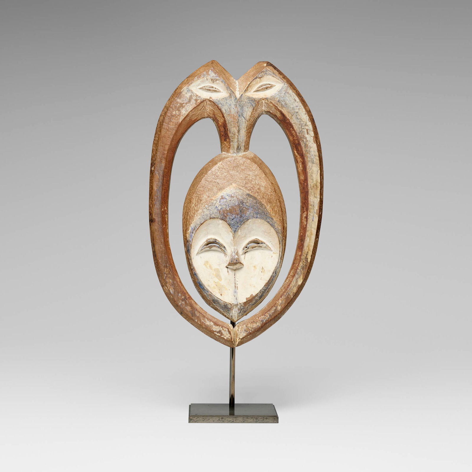 Kwele (Bakwele), Rare and Exceptional dance mask: Kwele (Bakwele) Rare and Exceptional dance mask Gabon, c. 1900 carved wood, native trade paints, charring, pigment 20 h x 12 w x 2 d in (51 x 30 x 5 cm) Sold with a digital copy of the original