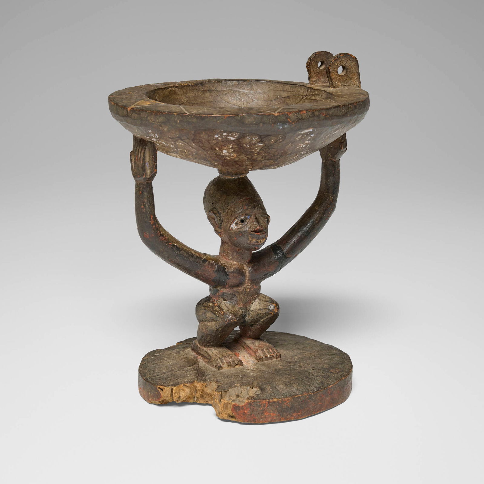 Yoruba, Agere Ifa divination bowl: Yoruba Agere Ifa divination bowl Nigeria, 20th century carved and painted wood 8.5 h x 5.5 dia in (22 x 14 cm) Sold with a digital copy of the original invoice from Herbert Baker, Inc. 
