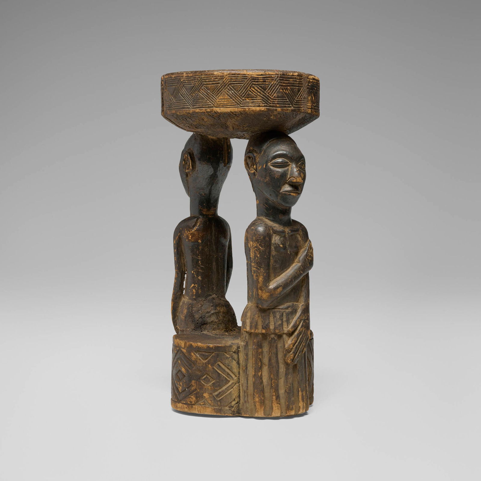 Yoruba, Figural stool: Yoruba Figural stool Nigeria, 20th century carved wood 21 h x 11 dia in (53 x 28 cm) Provenance: Collection of Marlene Shatkin, Winnetka, IL This work will ship from Chicago, Illinois.