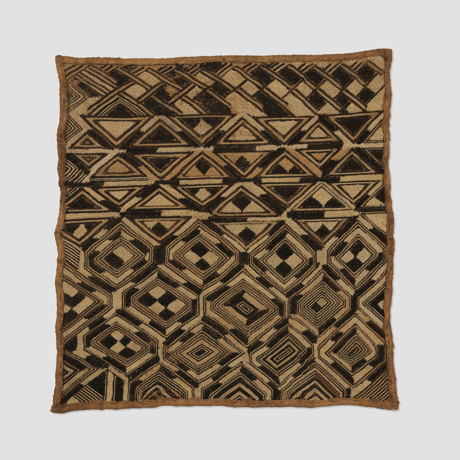 Kuba, Shoowa prestige panel: Kuba Shoowa prestige panel Democratic Republic of the Congo, 20th century raffia, fibers 19.5 h x 18 w in (50 x 46 cm) Provenance: Collection of Robert and Lisa Kessler This work will ship from