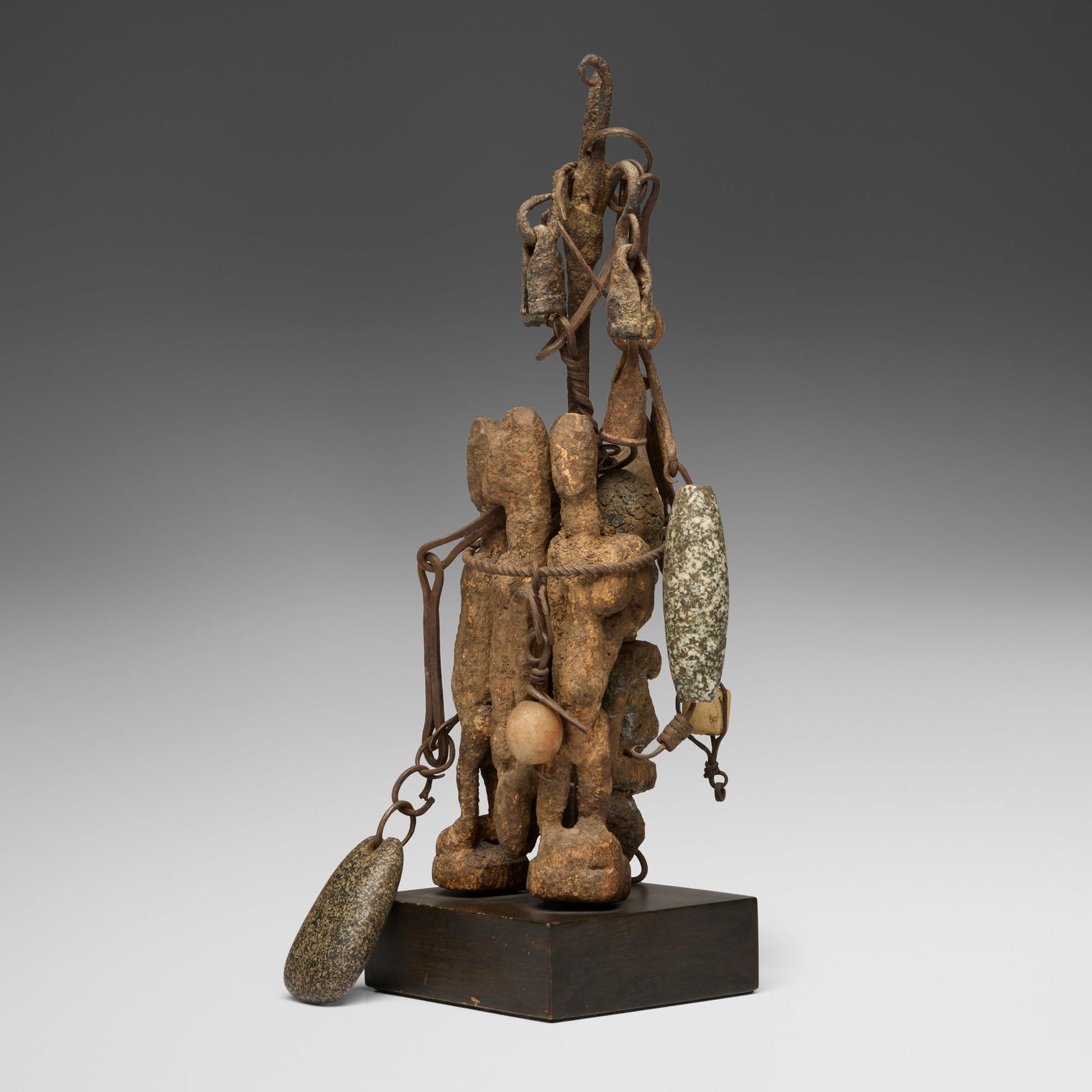 Dogon, Power object: Dogon Power object Mali, 20th centurycarved wood, iron, stone 14.375 h x 6.5 w x 5 d in (37 x 17 x 13 cm) This Dogon power object is composed of multiple small carved figure clustered together