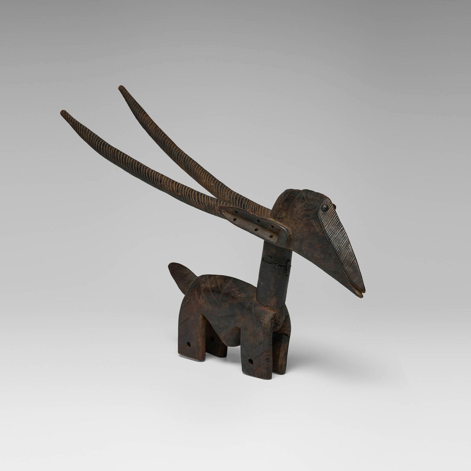 Bamana, Horizontal Ci Wara (antelope headdress): Bamana Horizontal Ci Wara (antelope headdress) Mali, 20th century carved wood 16.5 h x 29 w x 5 d in (42 x 74 x 13 cm) This example originates from the Bamba village in northern Mali where