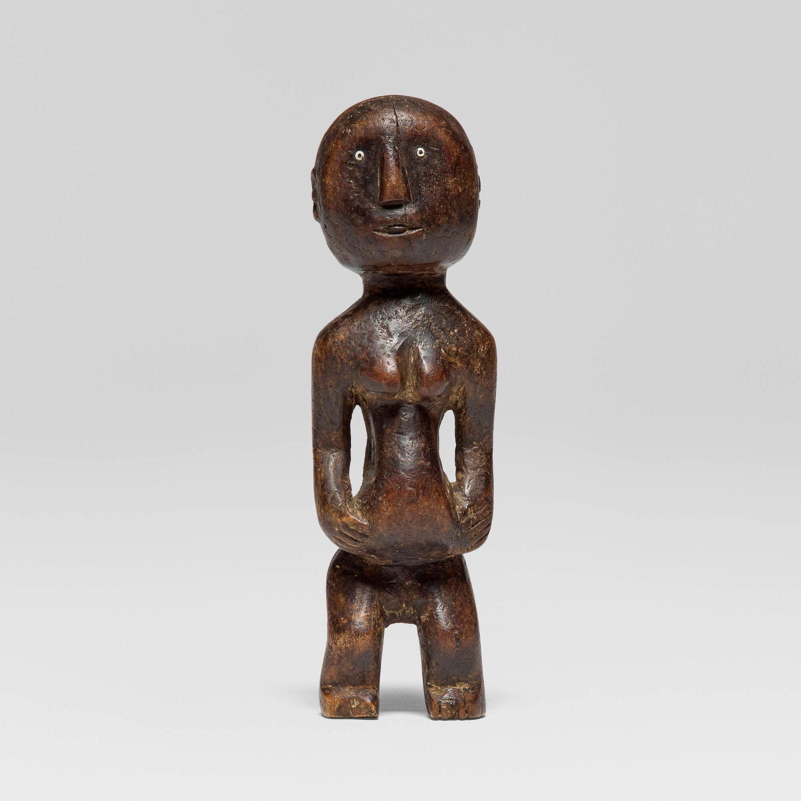 Sukuma or Nyamwezi, Standing female figure: Sukuma or Nyamwezi Standing female figure Tanzania, 20th century carved wood, beads 11.25 h x 3.5 w x 3 d in (29 x 9 x 8 cm) Provenance: Jean-Pierre Hallet, Malibu | Private Collection, Los