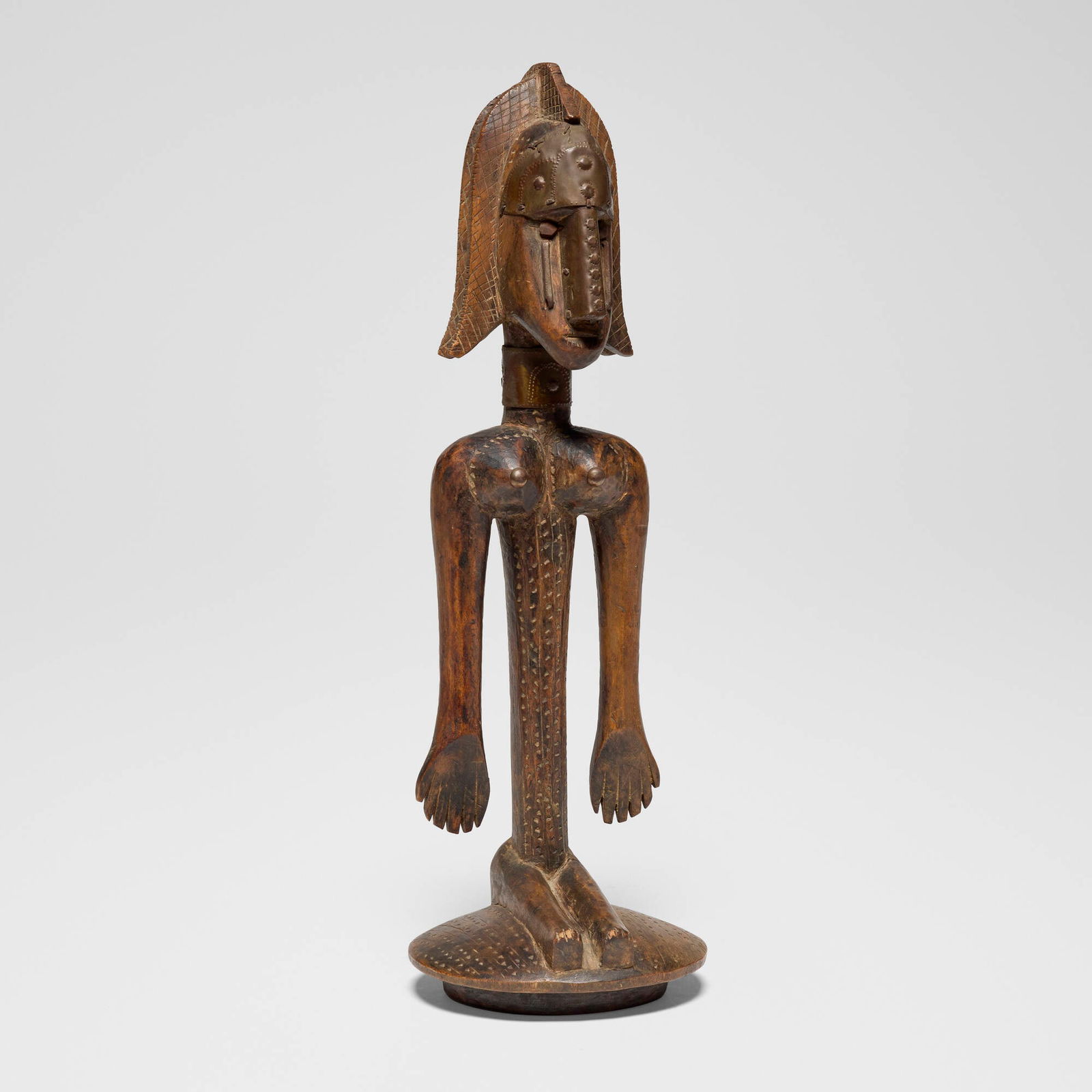 Bamana, Female ancestor stopper for vessel: Bamana Female ancestor stopper for vessel Mali, first half 20th century carved wood, copper 20.5 h x 6.5 w x 6.5 d in (52 x 17 x 17 cm) Provenance: Fily Keita Tribal Arts, Los Angeles | Private