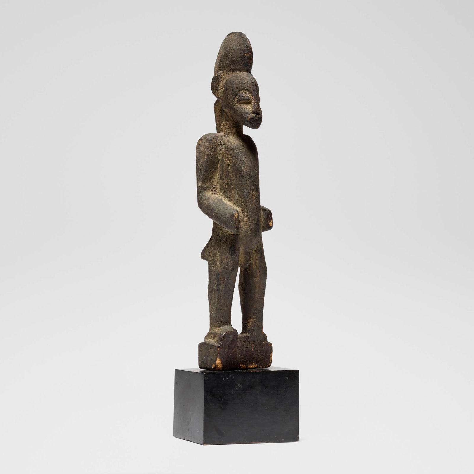 Senufo, Standing ancestor figure: Senufo Standing ancestor figure Cote d'Ivoire, 20th century carved wood 8.75 h x 4 w x 4 d in (22 x 10 x 10 cm) Provenance: Jean-Pierre Hallet, Malibu | Private Collection, Los Angeles This work