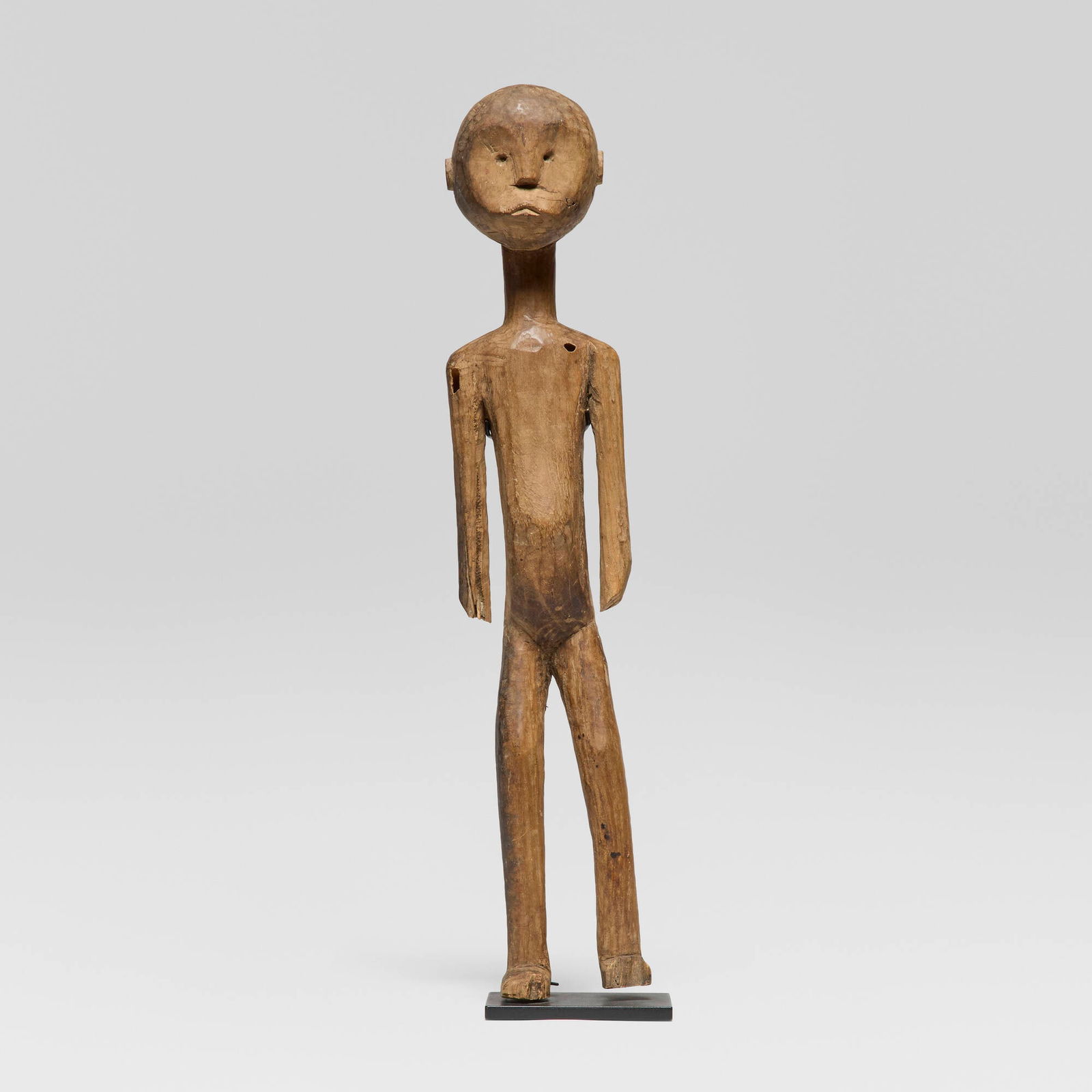 Sukuma or related group, Standing figure: Sukuma or related group Standing figure Western Tanzania, 20th century carved wood 26.25 h x 5 w x 4.75 d in (67 x 13 x 12 cm) This work is documented in the Van Rijn Archive of African Art