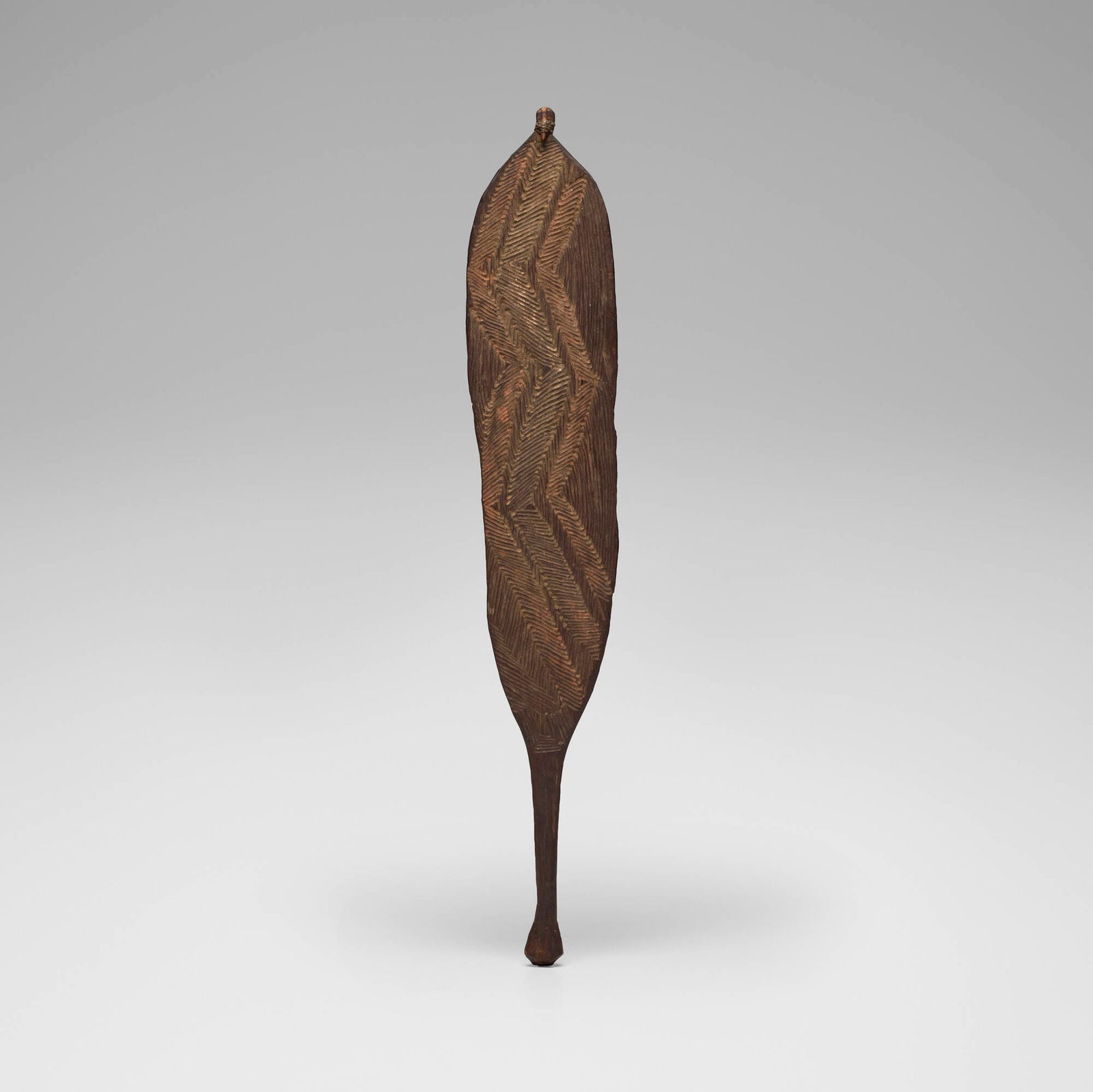 Aboriginal, Woomera spear thrower: Aboriginal Woomera spear thrower Western Australia, early 20th century carved wood, red pigments 0.75 h x 5.5 w x 33 d in (2 x 14 x 84 cm) Provenance: Dorothy Wingert Gallery, Honolulu | Acquired