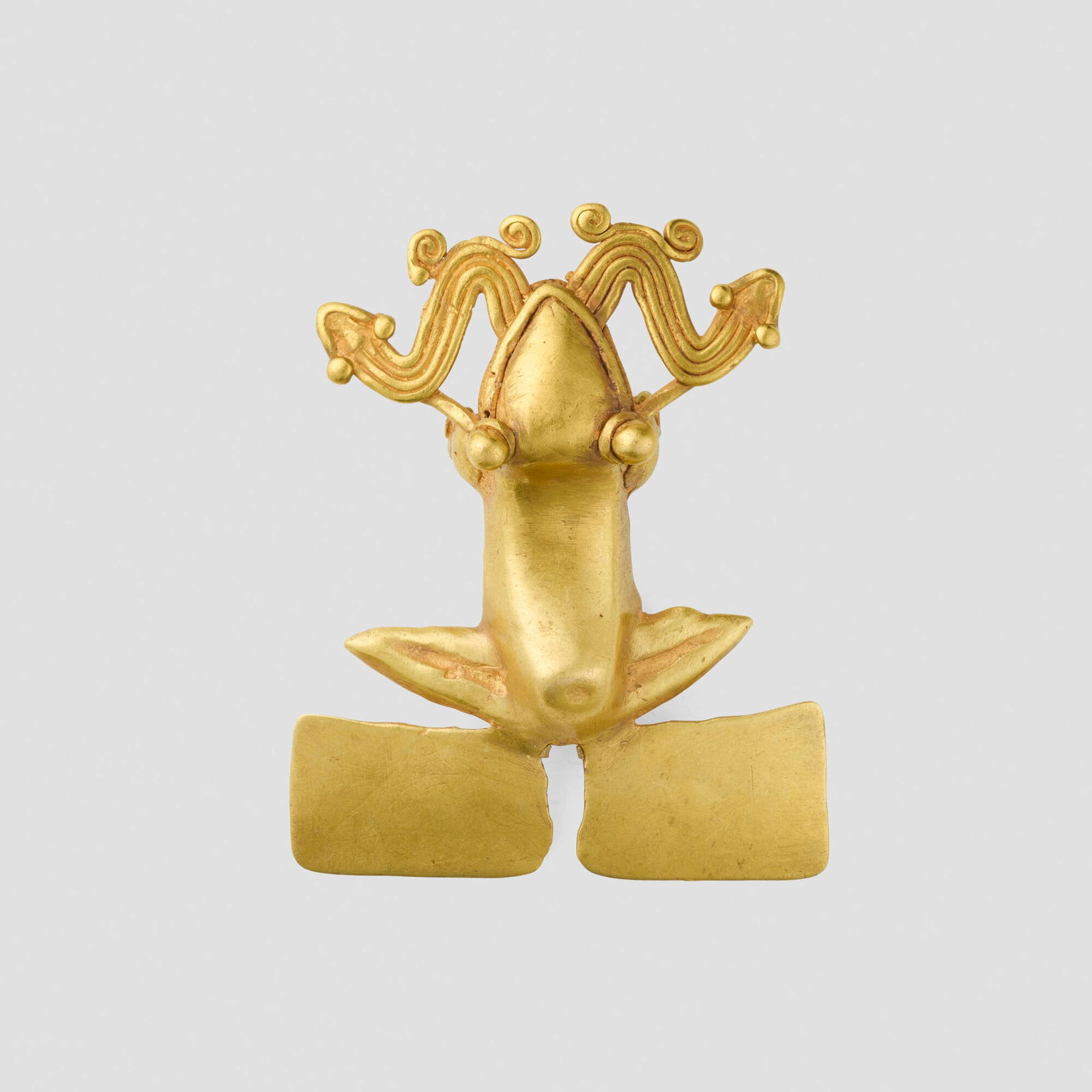 Chiriqui or Veraguas, Frog pendant with double-headed serpent: Chiriqui or Veraguas Frog pendant with double-headed serpent Costa Rica or Panama, 700-1500 CE 14k gold 2.5 h x 2 w x 0.75 d in (6 x 5 x 2 cm) Provenance: Andre Emmerich Gallery, New York |