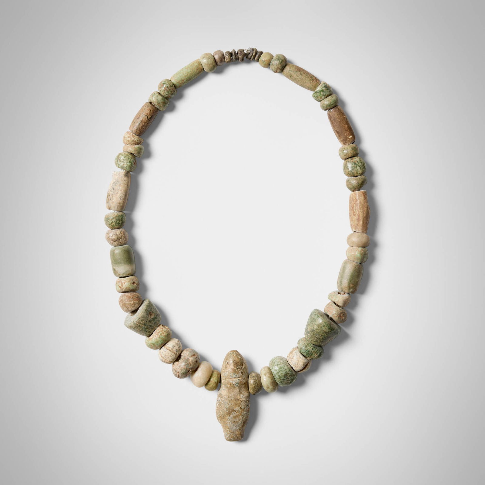 Mezcala, Greenstone necklace: Mezcala Greenstone necklace Guerrero, Mexico, 250-650 CE stone 23 l in (58 cm) This work will ship from Los Angeles, California.