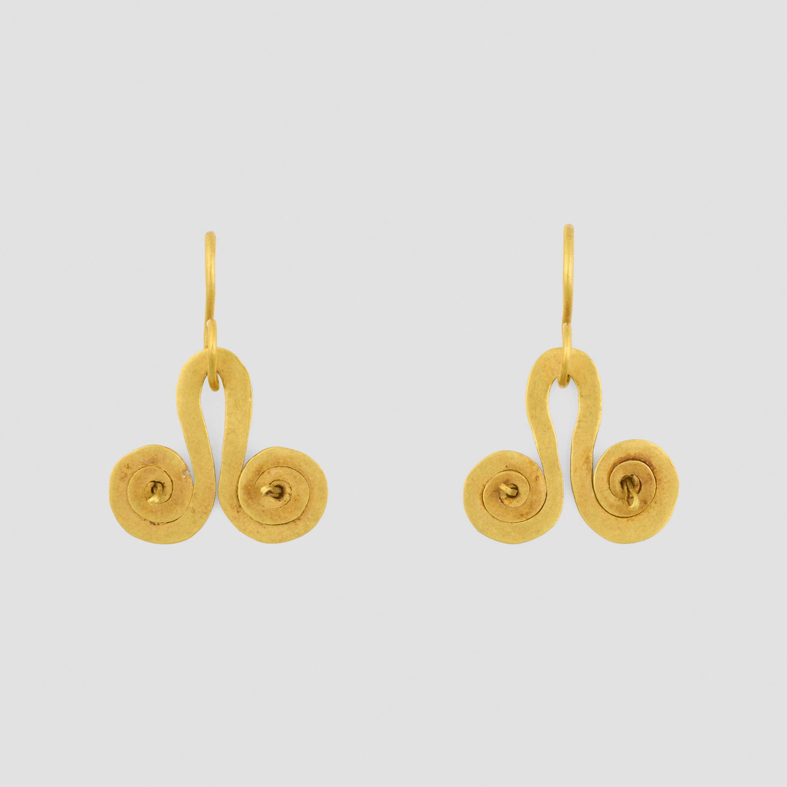 Tairona, Spiral earrings, pair: Tairona Spiral earrings, pair Colombia, c. 400 BCE-1500 CE 18k gold 0.75 h x 0.875 w in (2 x 2 cm) Provenance: Andre Emmerich Gallery, New York | Private Collection This work will ship from