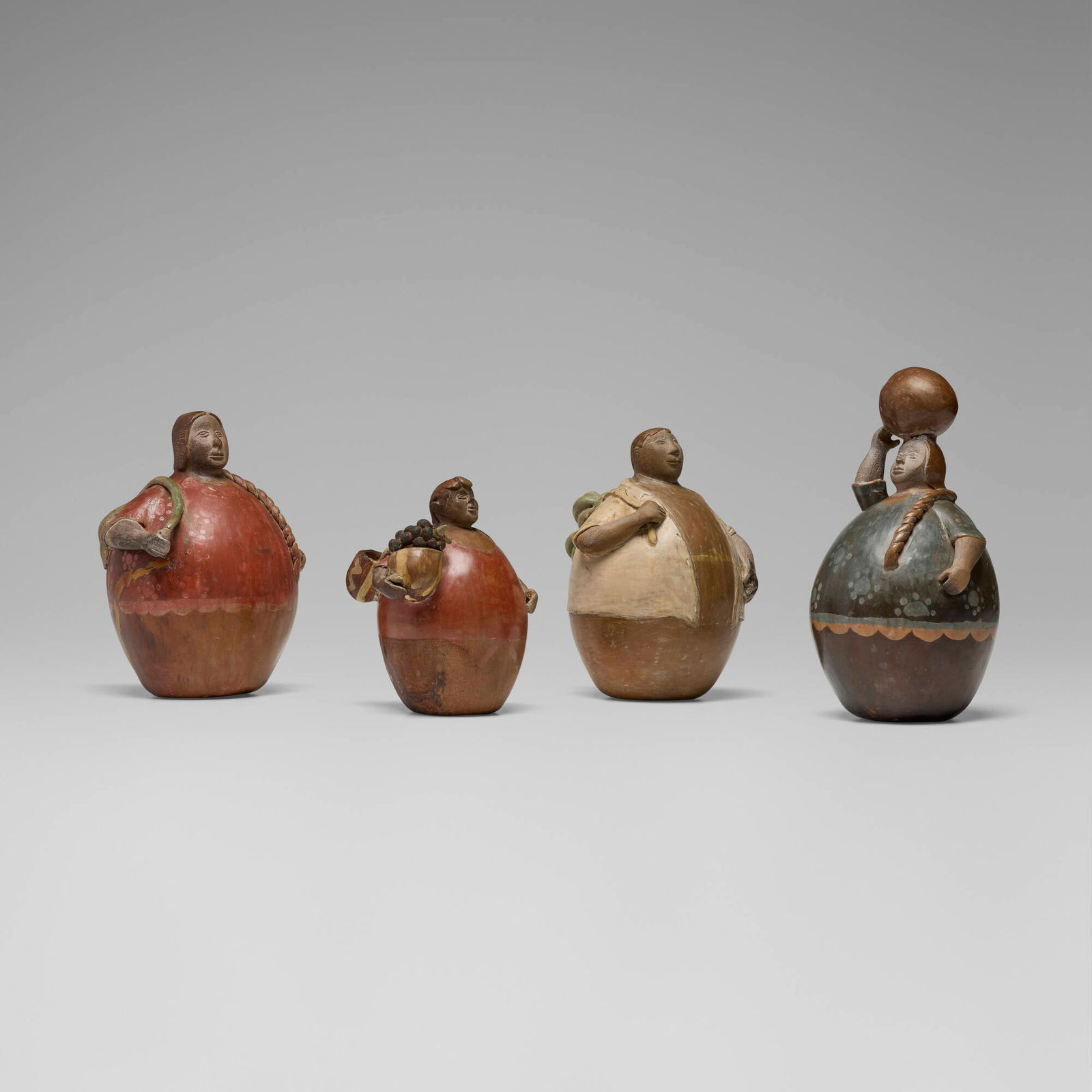 Chulacana, Folk Art figures, set of four: Chulacana Folk Art figures, set of four Peru, c. 1970 painted earthenware largest: 9.75 h x 6 dia in (25 x 15 cm) smallest: 6.75 h x 5 dia in (17 x 13 cm) Incised signature to underside of two