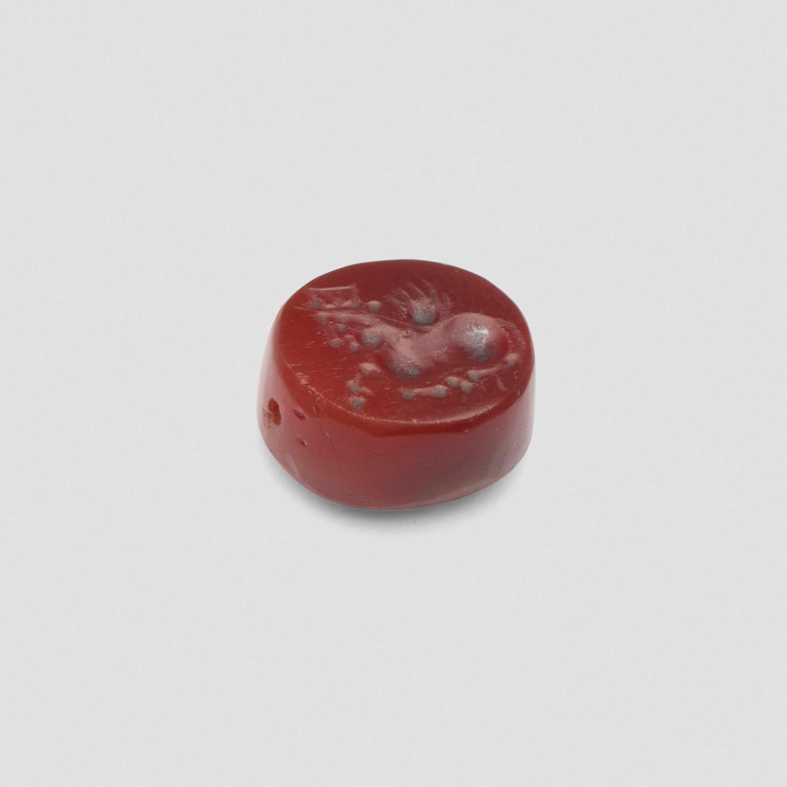 Greco-Persian, Scaraboid with winged sphinx: Greco-Persian Scaraboid with winged sphinx c. 4th century BCE Carnelian stone 0.25 h x 0.5 dia in (1 x 1 cm) Provenance: Private Collection, brought to the US in 1983 | Christie's, New York,