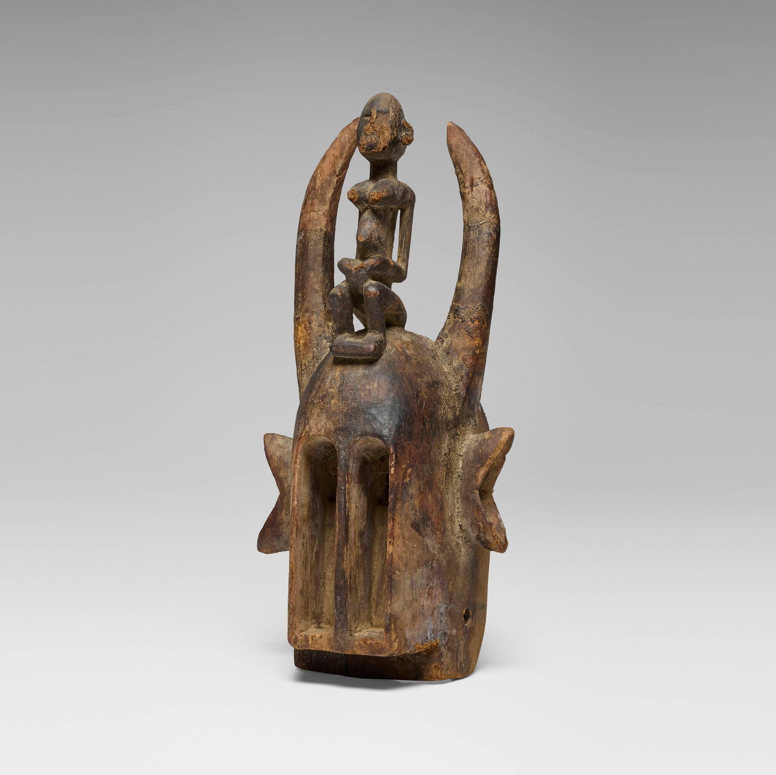 Dogon, Mask with figure: Dogon Mask with figure Mali, 20th century carved wood 21 h x 9.5 w x 8.5 d in (53 x 24 x 22 cm) This work will ship from Chicago, Illinois.