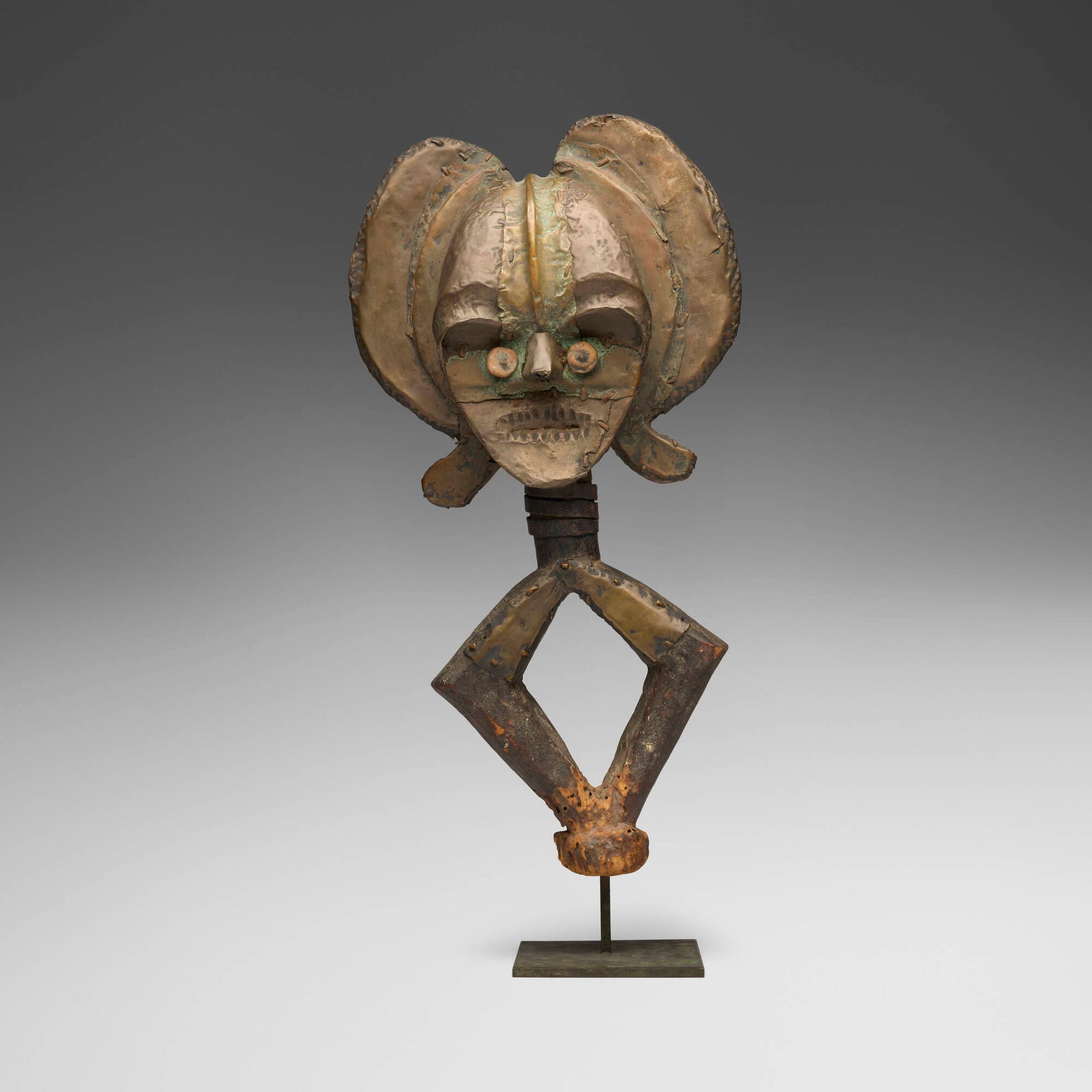 Kota, Mbulu Ngulu reliquary guardian figure: Kota Mbulu Ngulu reliquary guardian figure Gabon, 20th century wood, copper, iron, brass 19.25 h x 10 w x 4.5 d in (49 x 25 x 11 cm) Provenance: Aaron Furman Gallery, New York | Private Collection