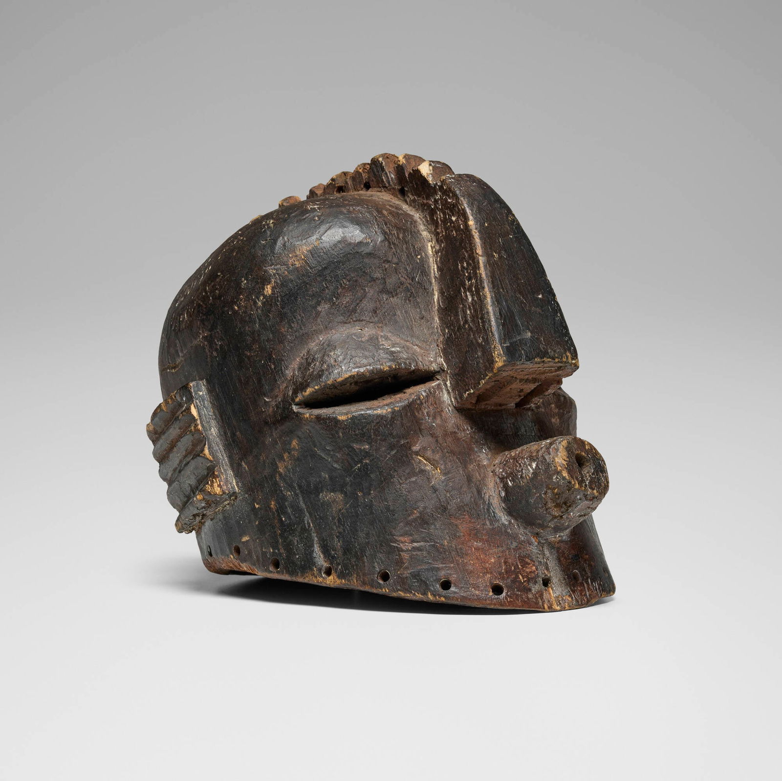 Binji, Helmet mask: Binji Helmet mask Democratic Republic of Congo, 20th century carved wood 9.5 h x 9 w x 12 d in (24 x 23 x 30 cm) This work will ship from Chicago, Illinois.