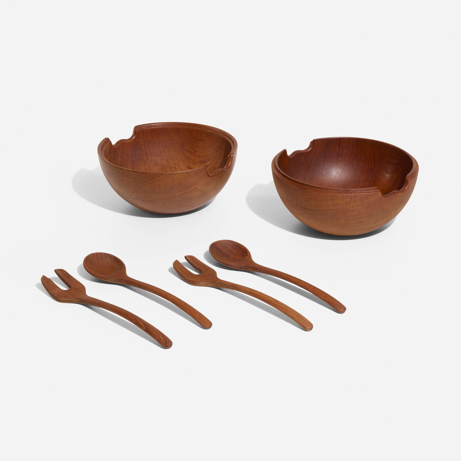 Kay Bojesen, Salad set: Kay Bojesen Salad set Denmark, c. 1955teak 8.875 h x 18 w x 10 d in (23 x 46 x 25 cm) Set is comprised of two interlocking bowls and two serving utensils. This work will sh