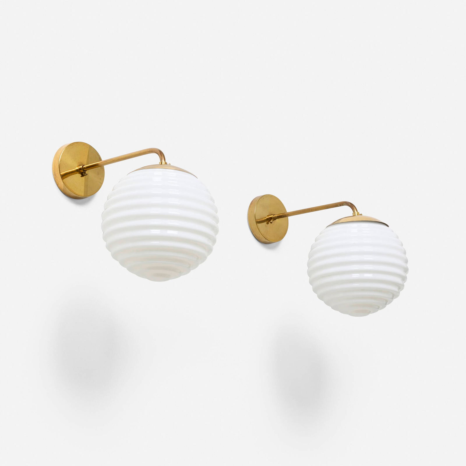 Lisa Johansson-Pape, Wall lamps, pair: Lisa Johansson-Pape Wall lamps, pair Orno Finland, c. 1951 molded glass, brass 11 h x 7.5 w x 14.5 d in (28 x 19 x 37 cm) Impressed manufacturer's mark to each socket 'ORNO'. Provenance: Private