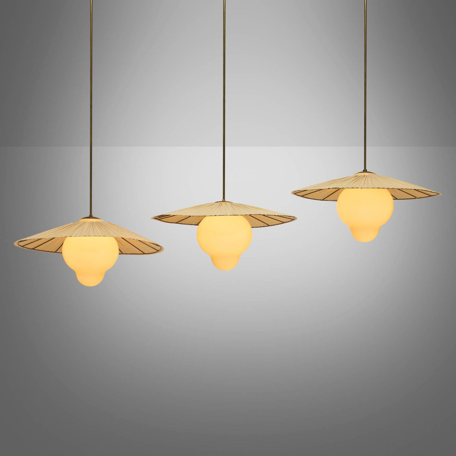 Paavo Tynell, Hanging lamps, set of three: Paavo Tynell Hanging lamps, set of three Taito Oy Finland, c. 1935 glass, wood veneer, brass 58 h x 25.75 dia in (147 x 65 cm) Impressed manufacturer's mark to each fixture 'Taito'. This work