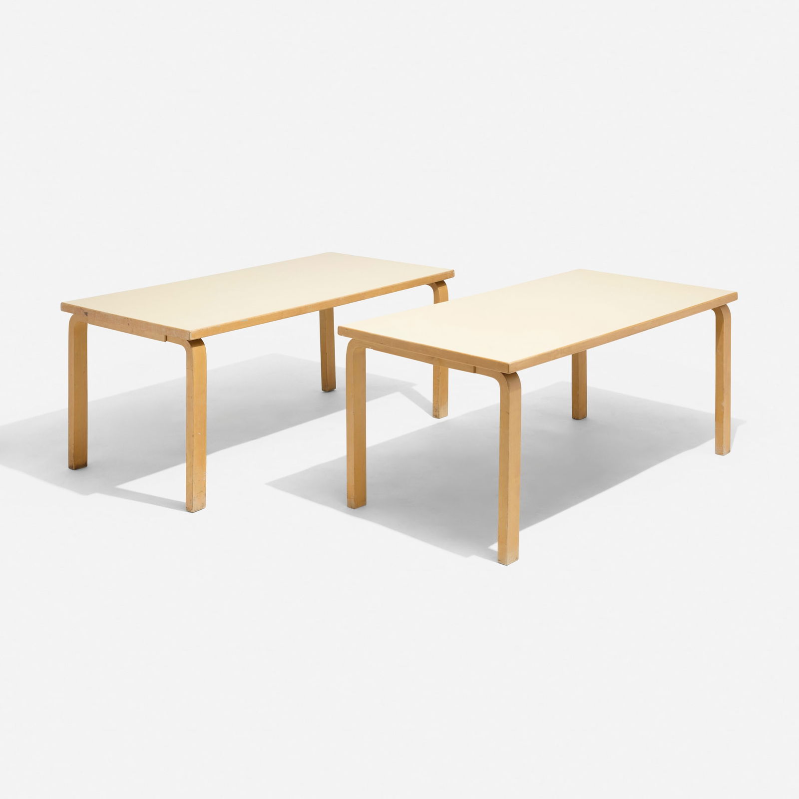 Alvar Aalto, Tables model 81B, pair: Alvar Aalto Tables model 81B, pair ArtekFinland, 1935 / c. 1955laminated birch, laminate 27.25 h x 59 w x 25.5 d in (69 x 150 x 65 cm) This work will ship from Chicago, Illi