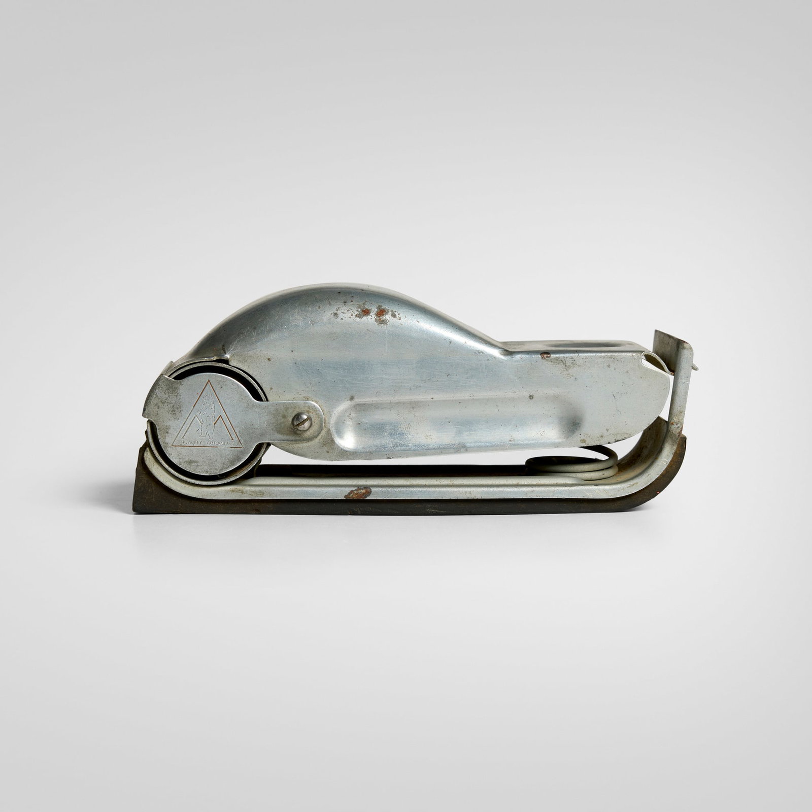 Behr-Manning Company, Speed-Grits hand sander: Behr-Manning Company Speed-Grits hand sander Toolcraft Corp. USA, c. 1945 zinc-plated steel, rubber 2.75 h x 2.125 w x 7 d in (7 x 5 x 18 cm) Impressed manufacturer's mark to exterior 'Quality