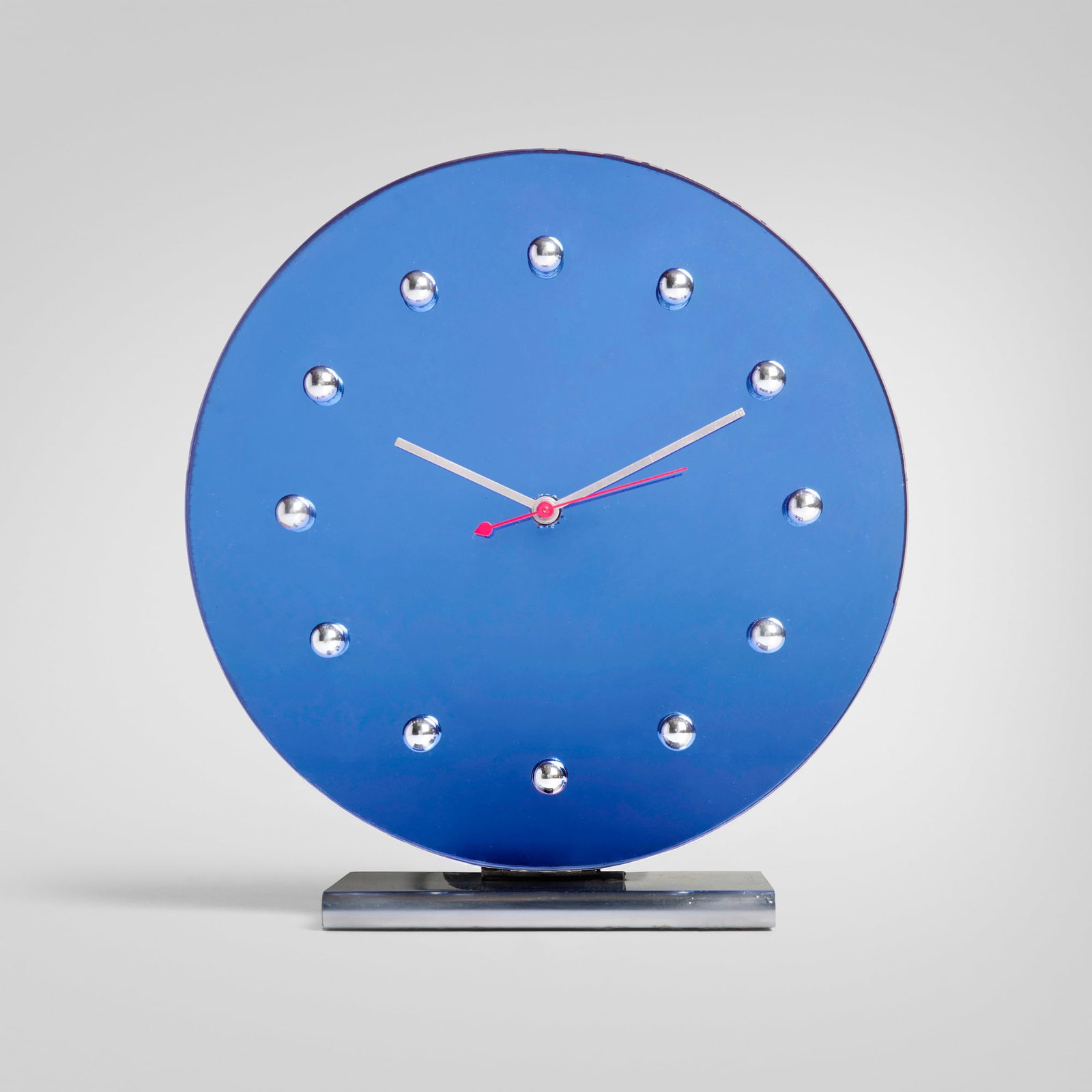 Gilbert Rohde, Table clock: Gilbert Rohde Table clock Herman Miller Clock Company USA, 1933 blue mirrored glass, chrome-plated steel, chrome-plated and enameled metal 10.5 h x 10 w x 3.5 d in (27 x 25 x 9 cm) Provenance:
