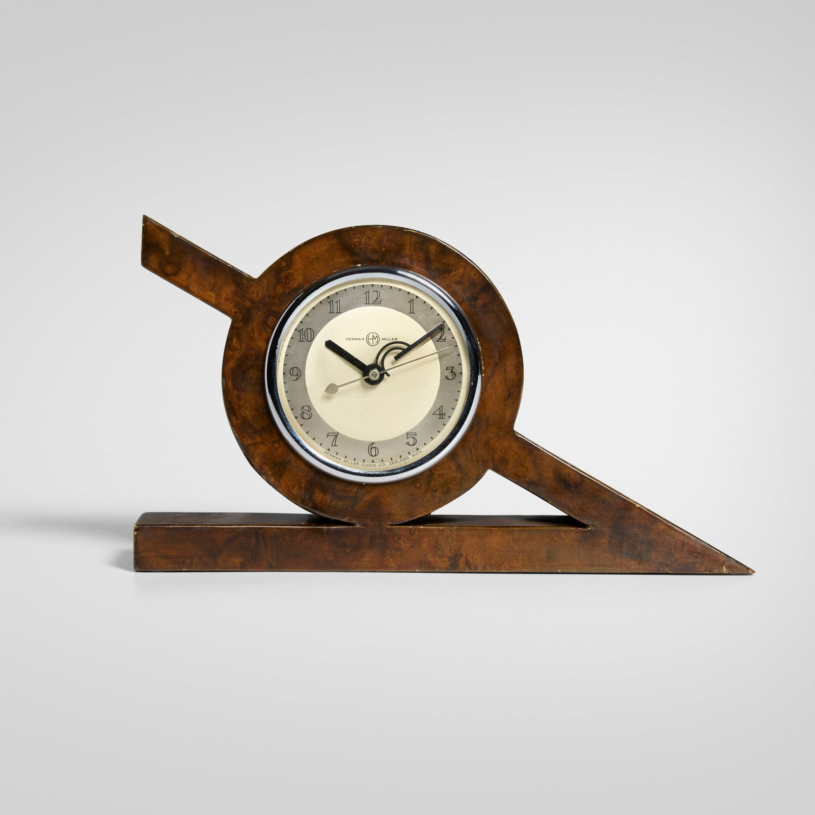 Gilbert Rohde, Table clock for the Century of Progress, Chicago: Gilbert Rohde Table clock for the Century of Progress, Chicago Herman Miller USA, c. 1934 burl veneer, chromed metal, glass 6.5 h x 11.5 w x 2.25 d in (17 x 29 x 6 cm) This design was created for