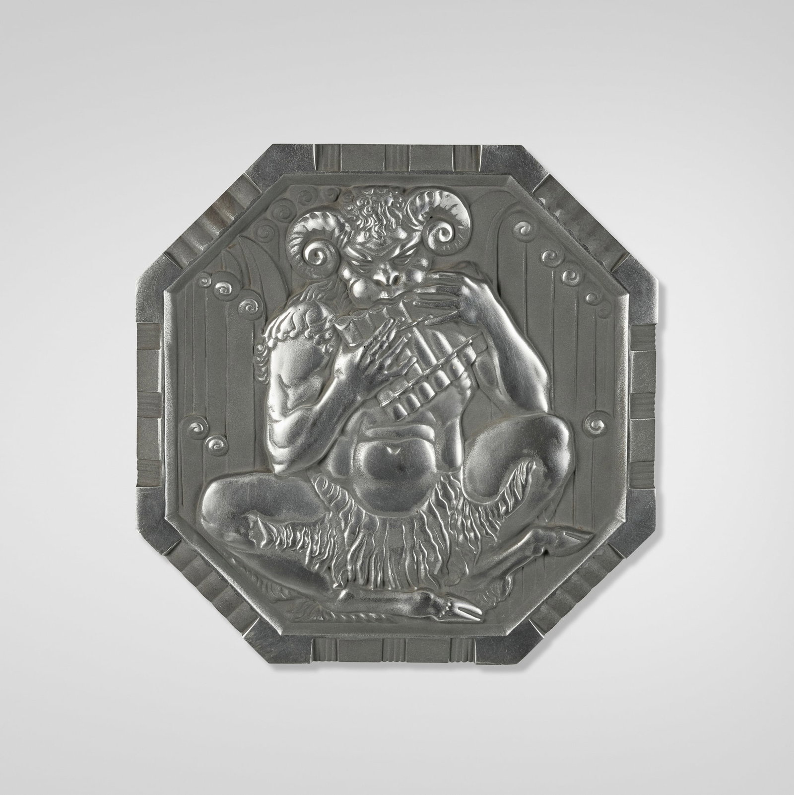 Alcoa, Art Deco wall plaque with Pan: Alcoa Art Deco wall plaque with Pan USA, c. 1943 cast aluminum 11.75 h x 11.75 w x 0.5 d in (30 x 30 x 1 cm) Impressed manufacturer's mark to reverse 'Alum. Co. of America Plaque No 8 Lynite Alcoa