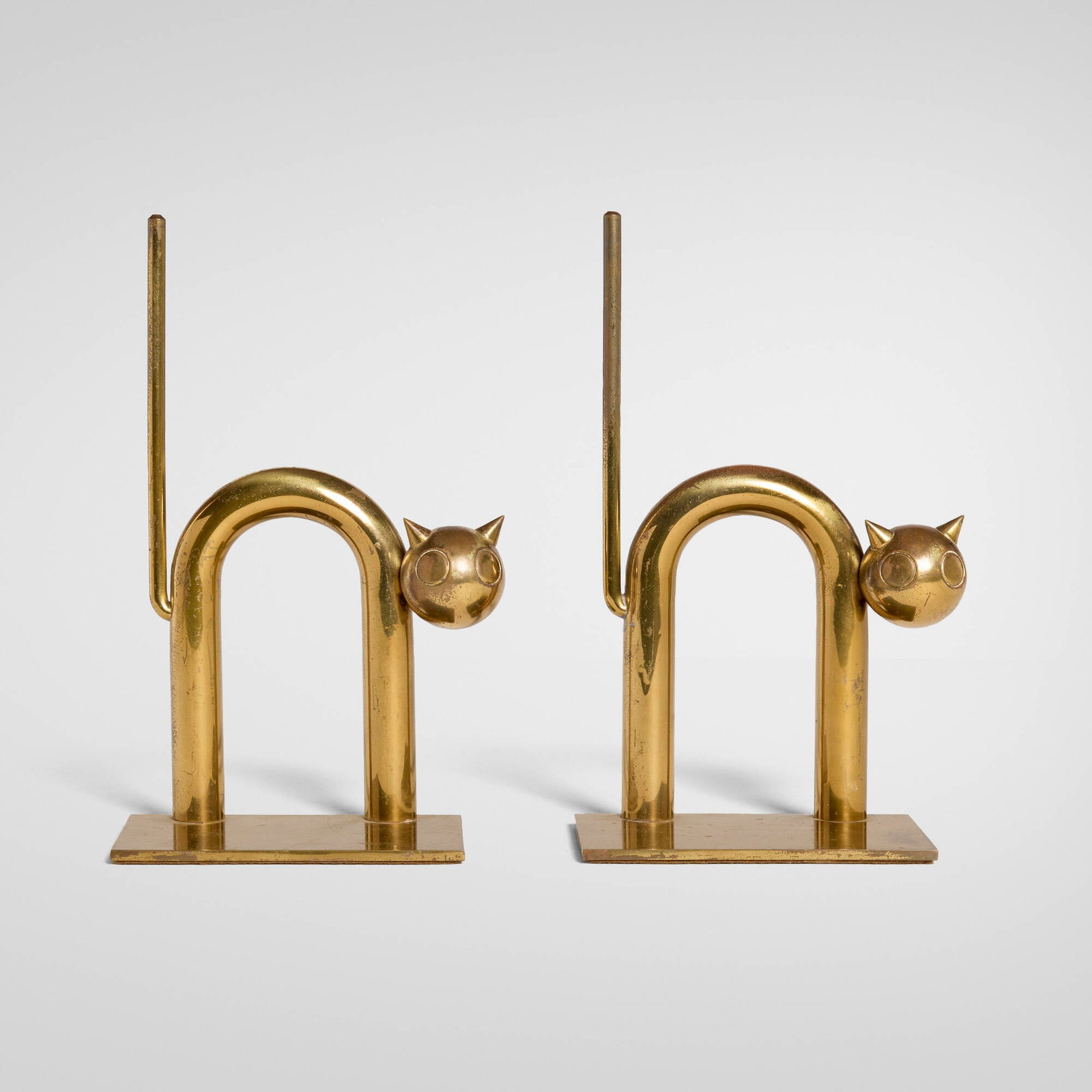 Walter von Nessen, Cat bookends model 17042, pair: Walter von Nessen Cat bookends model 17042, pair Chase Brass & Copper Co. USA, c. 1930 brass-plated copper each: 7.25 h x 4 w x 2.5 d in (18 x 10 x 6 cm) Impressed manufacturer's mark to lower