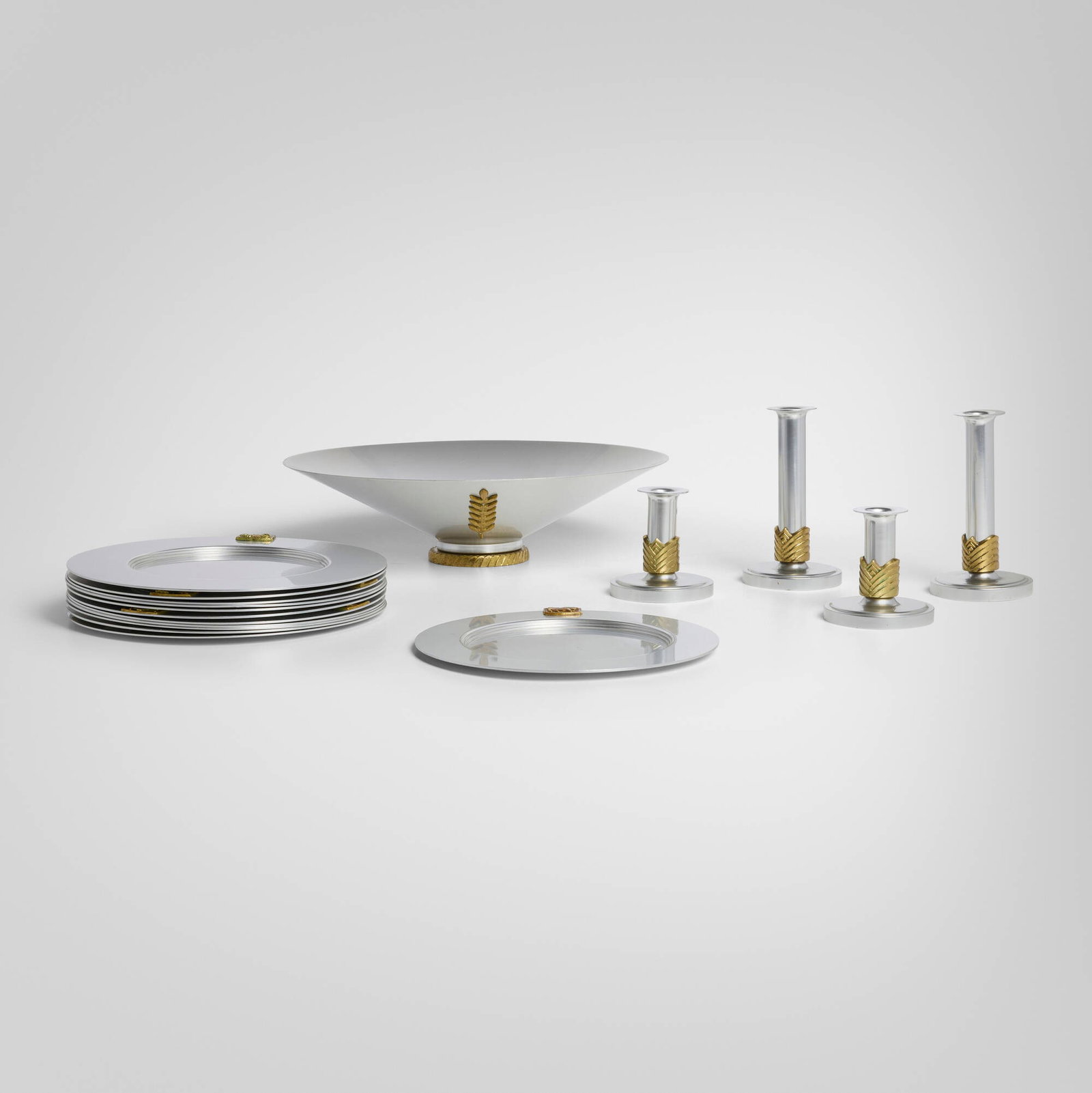 Lurelle Guild, Collection of table accessories from the Kensington series: Lurelle Guild Collection of table accessories from the Kensington series ALCOAUSA, 1934-35aluminum, gilt brass largest: 4.25 h x 16 dia in (11 x 41 cm) smallest: 4.125 h x 4 w in (10 x 10 cm