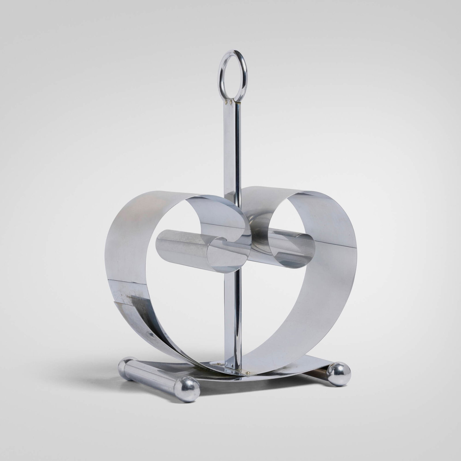 Norman Bel Geddes, Magazine rack: Norman Bel Geddes Magazine rack Revere Copper and Brass, Inc.USA, c. 1935chrome-plated brass 17.25 h x 12 w x 8.25 d in (44 x 30 x 21 cm) Impressed manufacturer's mark to underside 'Reve