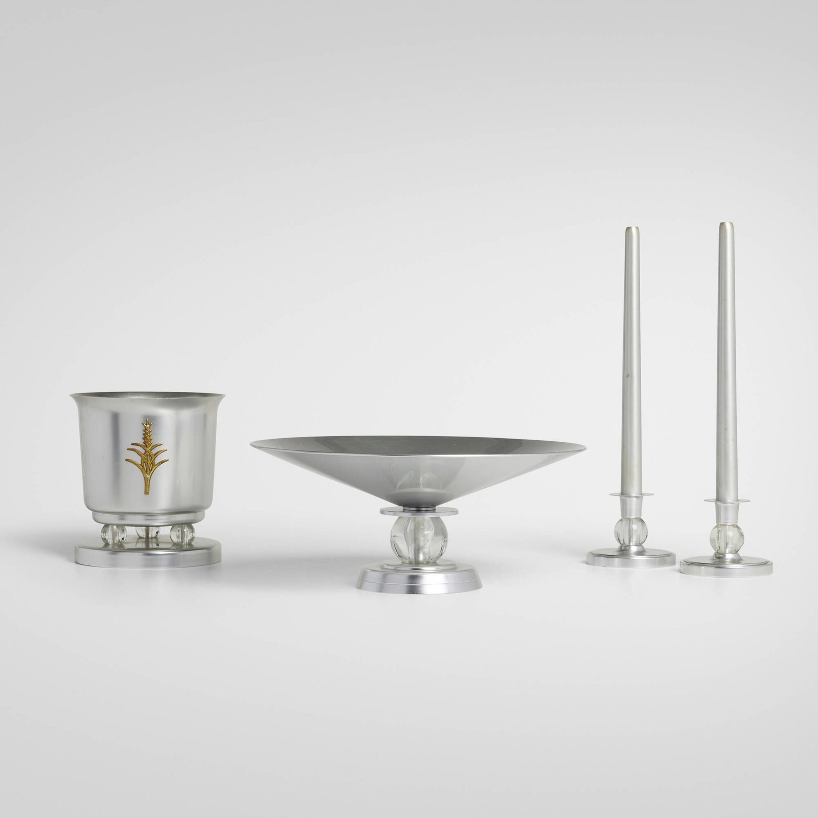 Lurelle Guild, Collection of table accessories from the Kensington series: Lurelle Guild Collection of table accessories from the Kensington series ALCOAUSA, 1934-36aluminum, glass, gilt brass centerpiece: 5.75 h x 13.5 dia in (15 x 34 cm) vase: 7.5 h x 7 dia in (1