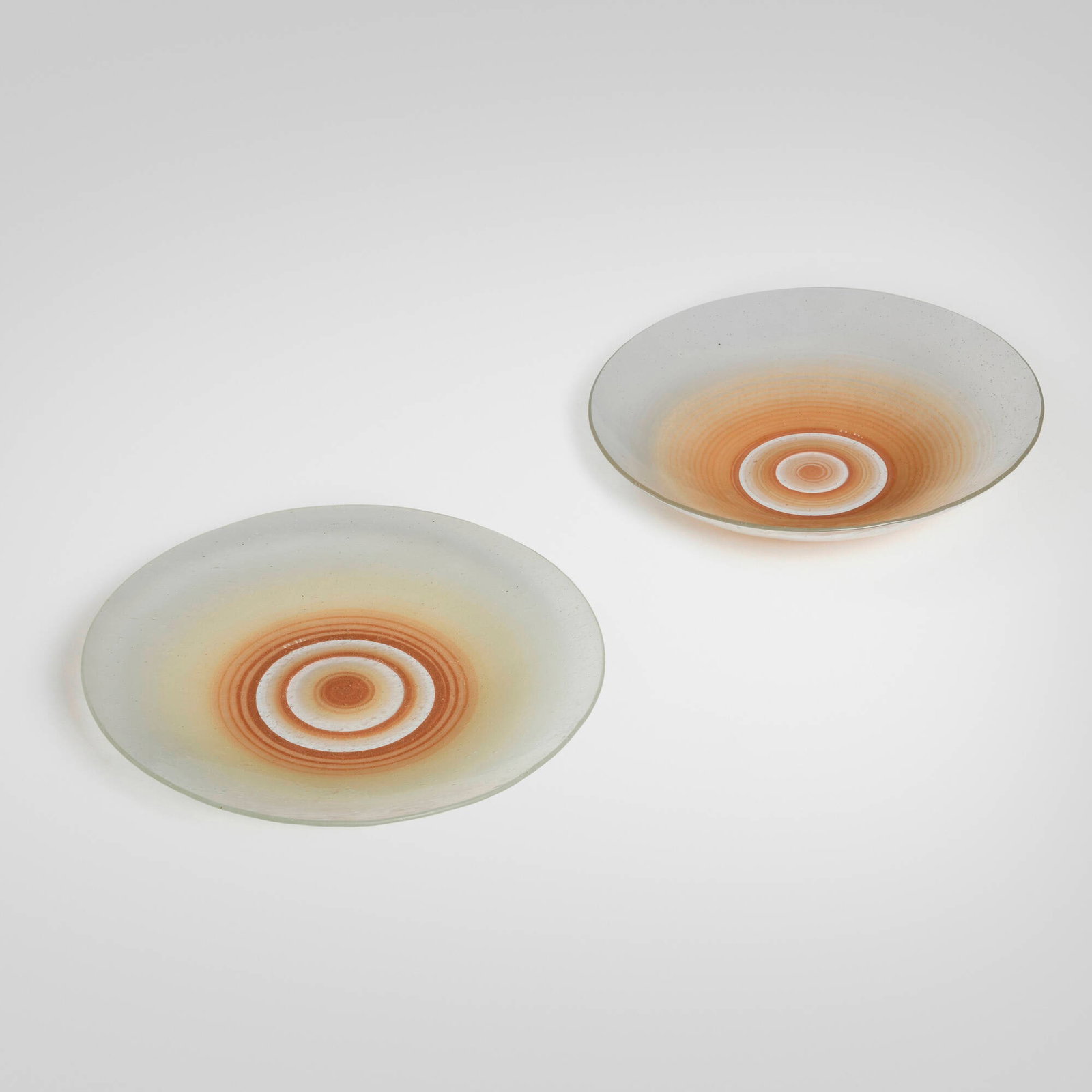 Maurice Heaton, Bowls, set of two: Maurice Heaton Bowls, set of two USA, c. 1930 enameled glass 3 h x 13.5 dia in (8 x 34 cm) 1.5 h x 14 dia in (4 x 36 cm) Etched signature to underside of each example 'MH'. Provenance: Private