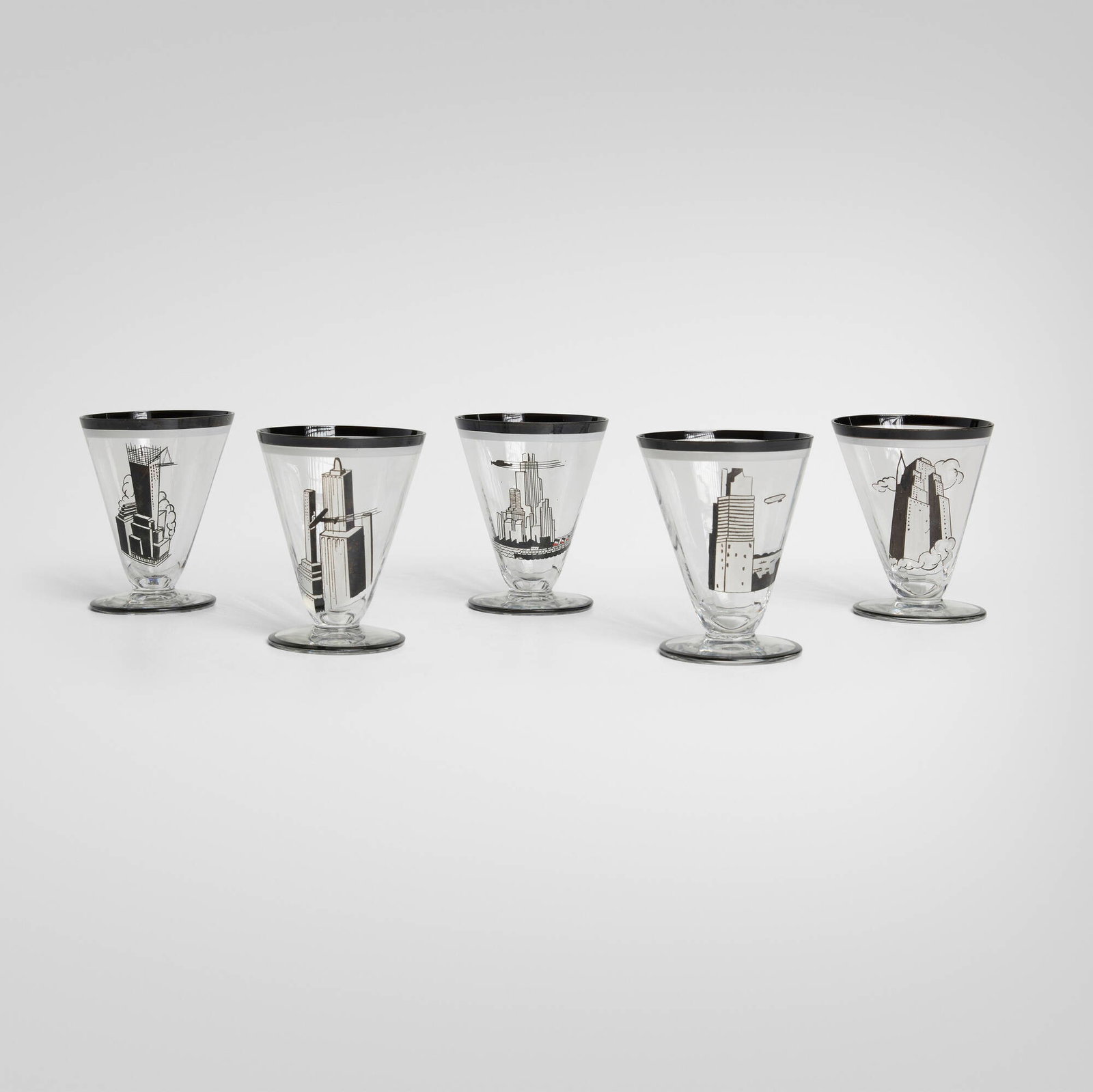Art Deco, Tumblers with skyscrapers, set of five: Art Deco Tumblers with skyscrapers, set of five c. 1935enameled glass 3.5 h x 2.75 dia in (9 x 7 cm) Provenance: Private Collection This work will ship fro