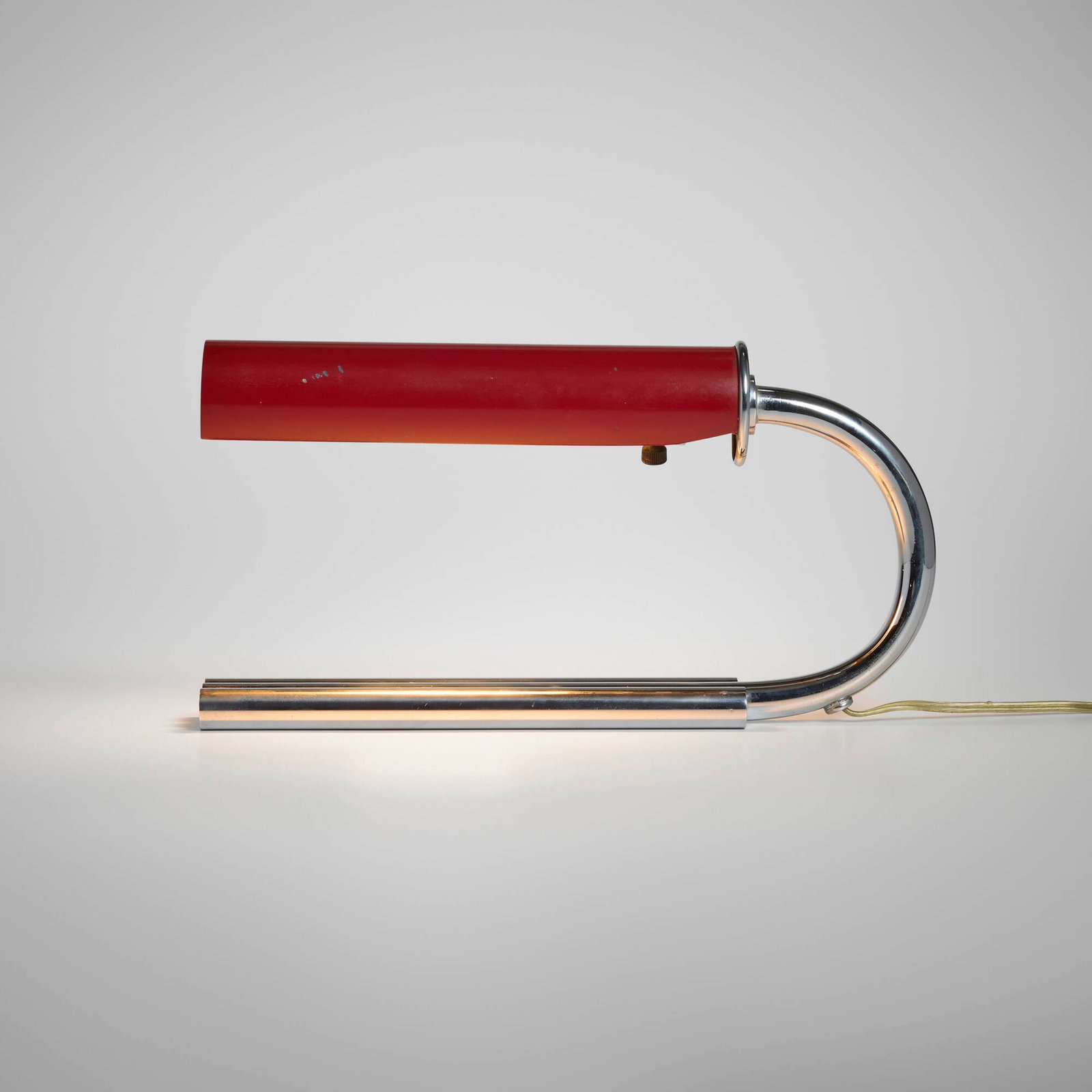 Gilbert Rohde, Desk lamp: Gilbert Rohde Desk lamp Mutual-Sunset Lamp Manufacturing CompanyUSA, 1933chrome-plated metal, lacquered metal 7 h x 13.5 w x 2.5 d in (18 x 34 x 6 cm) This design was included in the