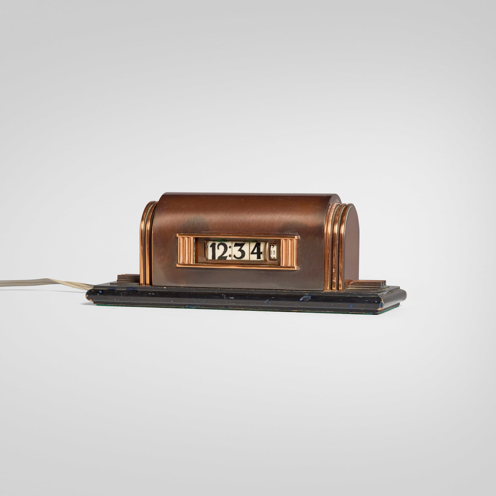 Lawson Time Inc., Table clock, model 208: Lawson Time Inc. Table clock, model 208 USA, c. 1933bronze, copper, Bakelite, lacquered wood 4.5 h x 11.5 w x 4.25 d in (11 x 29 x 11 cm) Impressed manufacturer's mark to reverse 'Lawson Time