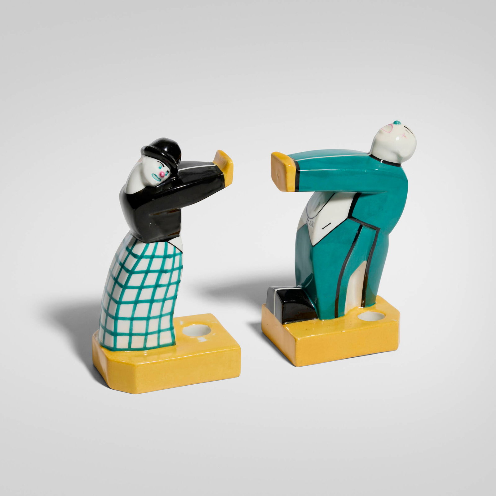 Robj, Clown push and pull bookends, pair: Robj Clown push and pull bookends, pair France, c. 1930 glazed and painted porcelain 8.25 h x 4.5 w x 3.375 d in (21 x 11 x 9 cm) Stamped manufacturer's mark to underside of one example 'Robj
