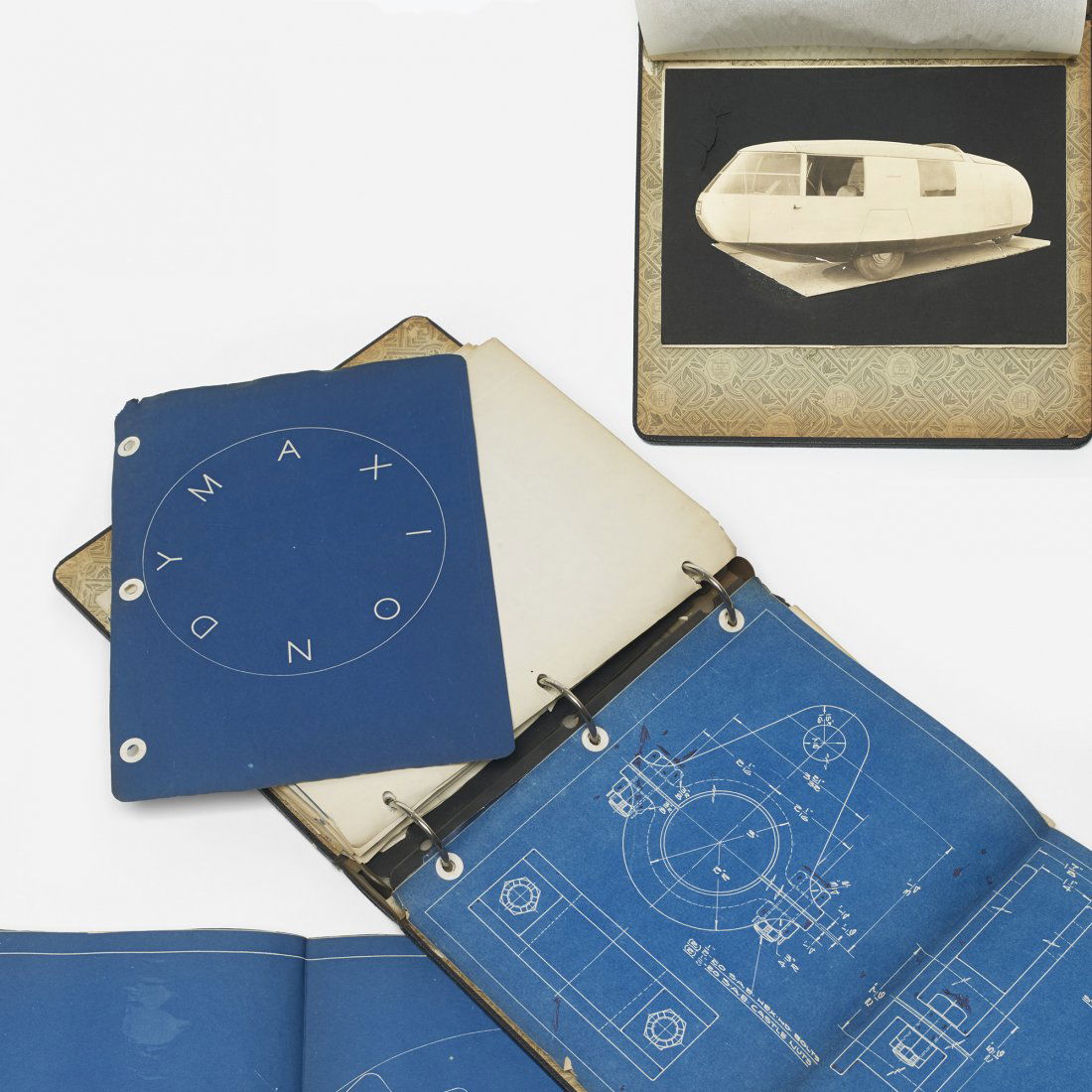 R. Buckminster Fuller Dymaxion blueprints: R. Buckminster Fuller Dymaxion blueprints USA, 1933 leather bound binder, blueprints, paper, photo collage 11.5 w x 10.5 d x 2.5 h inches Signed with title block to multiple pages.