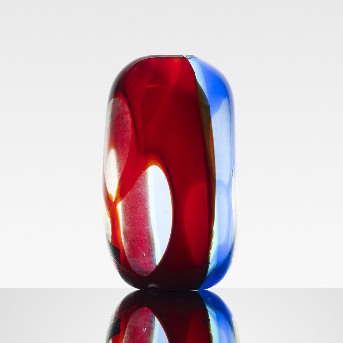 Anzolo Fuga Polichrome Asymmetrical vase: Anzolo Fuga Polichrome Asymmetrical vase A.V.E.M. Italy, c. 1958 polichrome glass 7.5 w x 7.5 d inches Signed with applied paper manufacturer's label to vase: [AVEM Arte Vetraria Muranese Via Vetrai 3