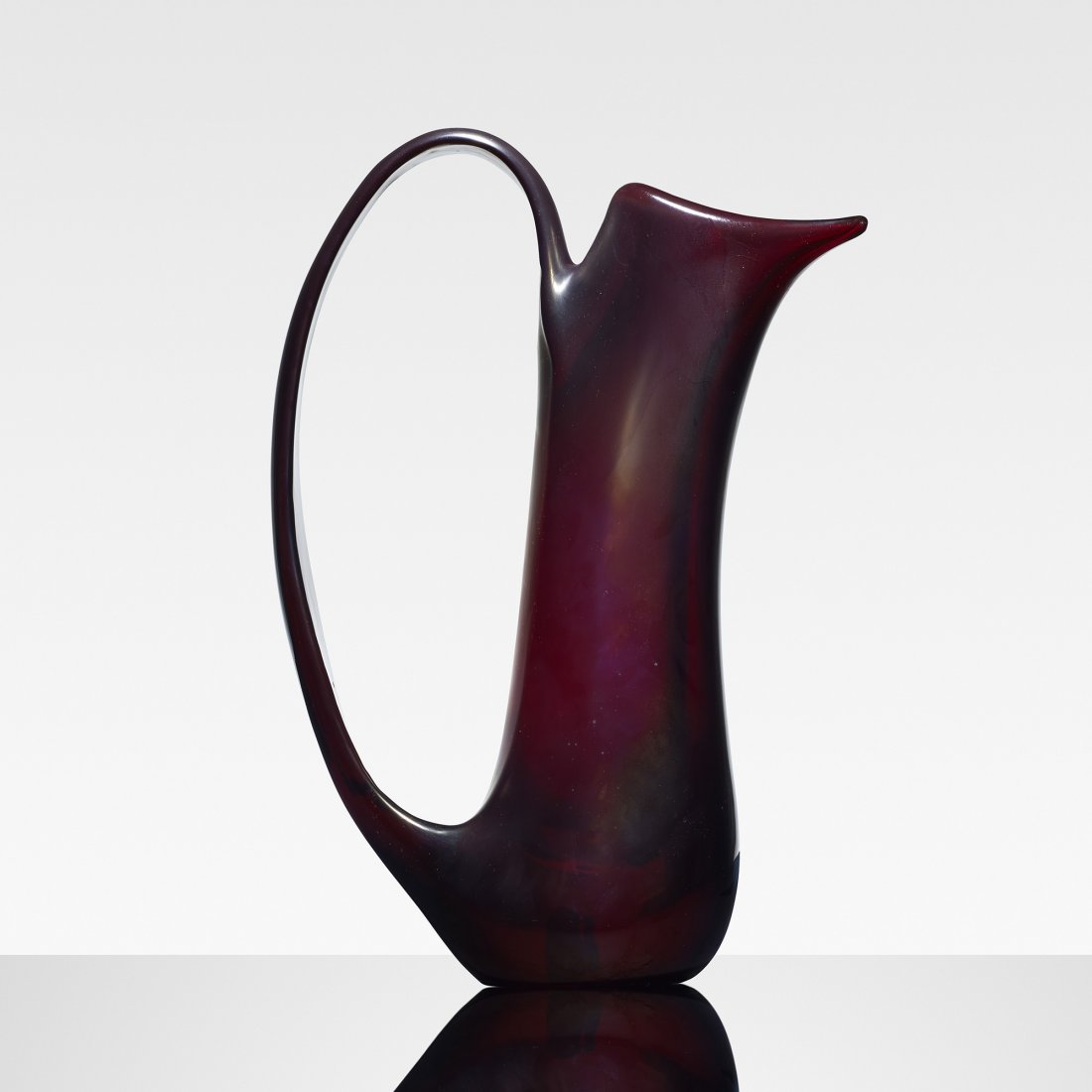 Giorgio Ferro Anse Volanti vase: Giorgio Ferro Anse Volanti vase A.V.E.M. Italy, 1950 iridized amethyst glass 10 w x 3.5 d x 14.5 h inches Literature: Murano Glass 1945-1970, Heiremans, pl. 10 illustrates this example Murano 900, Deb