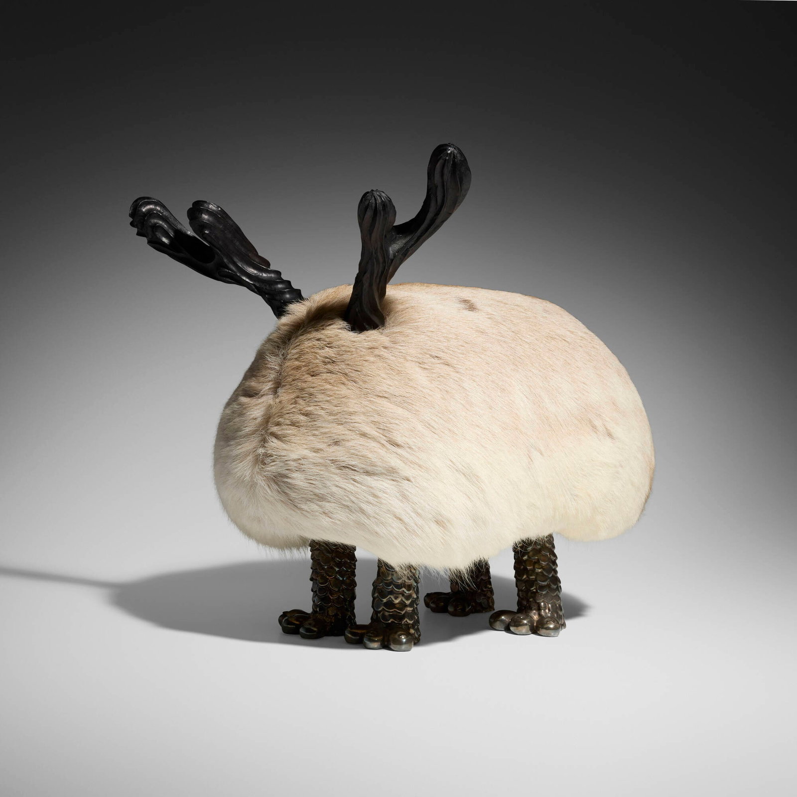 The Haas Brothers (Nikolai and Simon Haas), Bernie Mactus (Mini Beast stool): The Haas Brothers (Nikolai and Simon Haas) Bernie Mactus (Mini Beast stool) USA, 2016 Finnish reindeer fur, silver-plated cast bronze, carved ebony 17 h x 12.25 w x 16.5 d in (43 x 31 x 42 cm) 